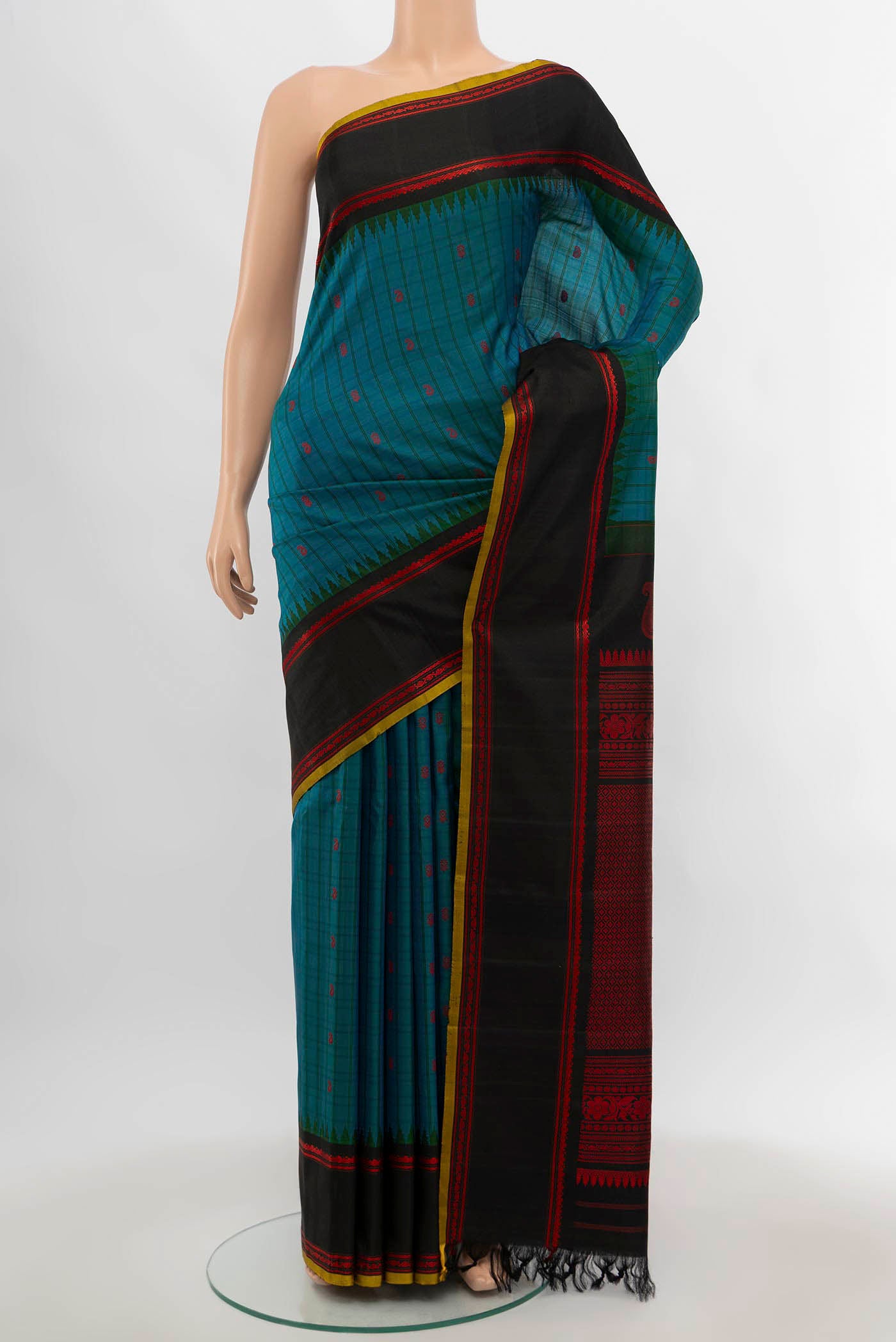 Peacock Blue Gadwal Silk Saree with Zari Butta on the body and Silk Border.  displayed on a mannequin