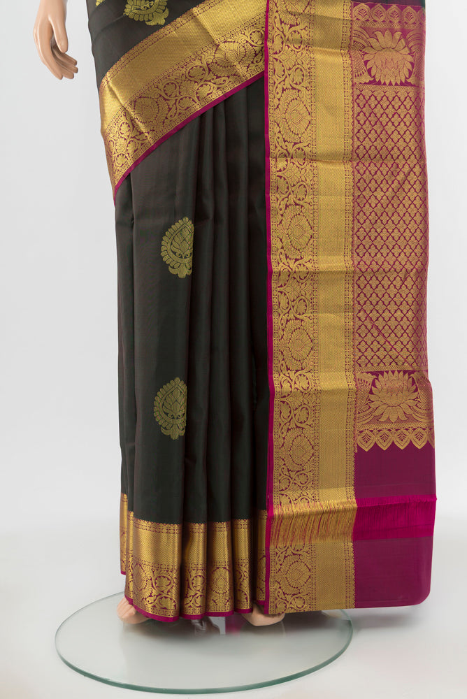 Pleats and pallu of Pure Silk Pure Zari Mint Green Kanchipuram Saree with Zari Butta on the body and Silk Border. 