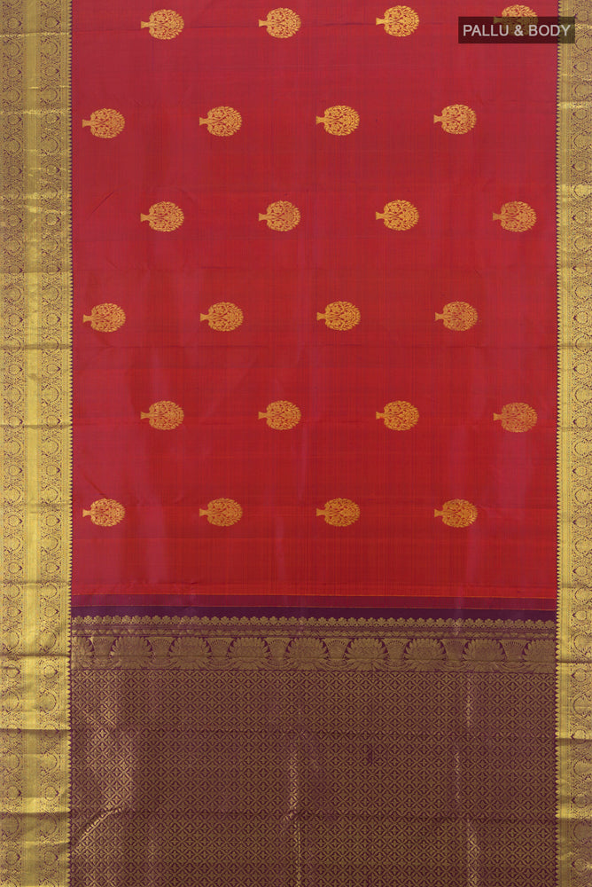 Flat view of Maroon Kanchipuram Silk Saree with Plain Body and Silk Border. 