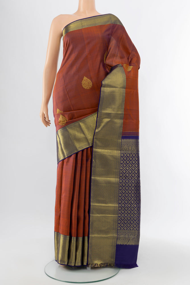 Teal Kanchipuram Silk Saree with Zari Butta on the body and Silk Border.  displayed on a mannequin