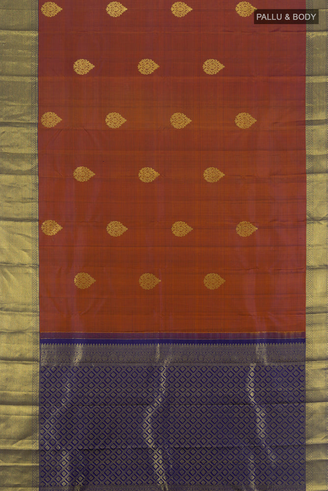 Flat view of Teal Kanchipuram Silk Saree with Zari Butta on the body and Silk Border. 