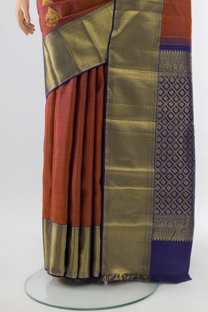 Pleats and pallu of Teal Kanchipuram Silk Saree with Zari Butta on the body and Silk Border. 