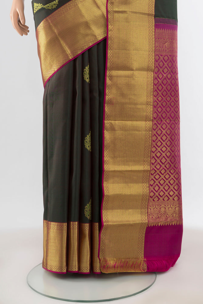 Pleats and pallu of Pure Silk Pure Zari Mint Green Kanchipuram Saree with Zari Butta on the body and Silk Border. 