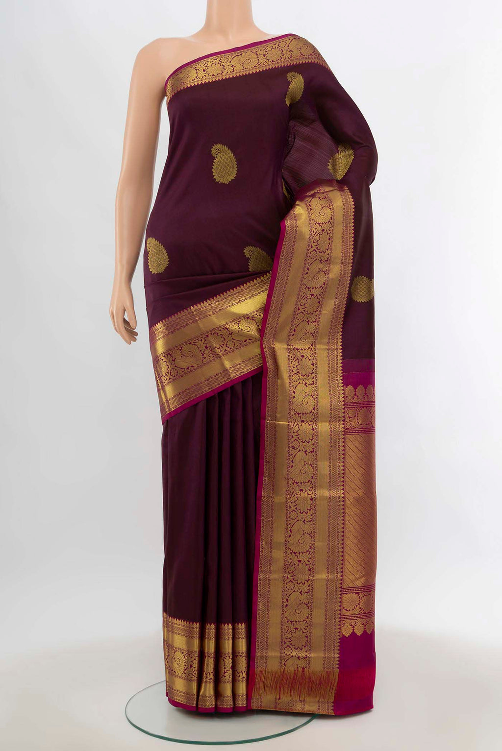 Coffee Brown Kanchipuram Silk Saree with Zari Butta on the body and Silk Border.  displayed on a mannequin