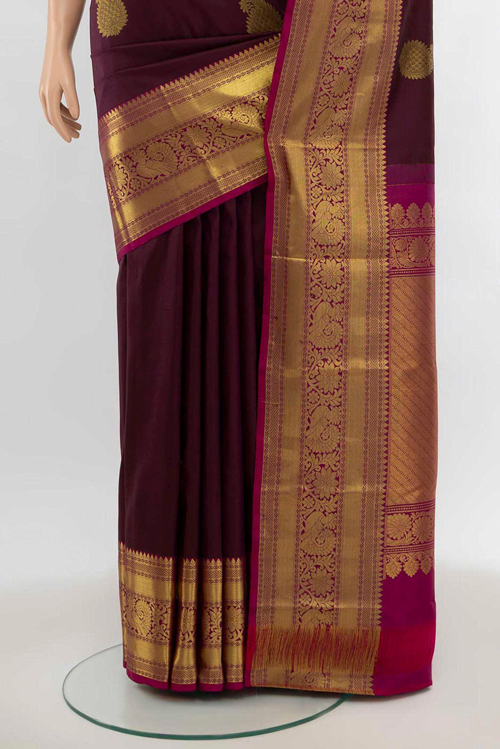 Pleats and pallu of Coffee Brown Kanchipuram Silk Saree with Zari Butta on the body and Silk Border. 