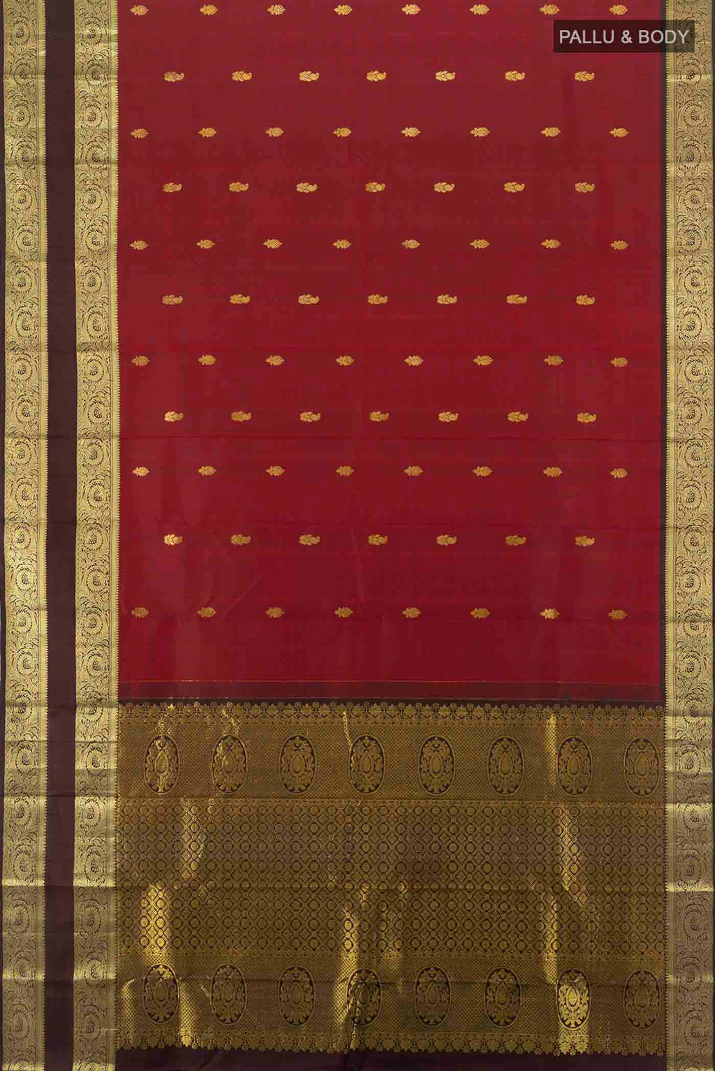 Flat view of Maroon Kanchipuram Silk Saree with Zari Butta on the body and Silk Border. 