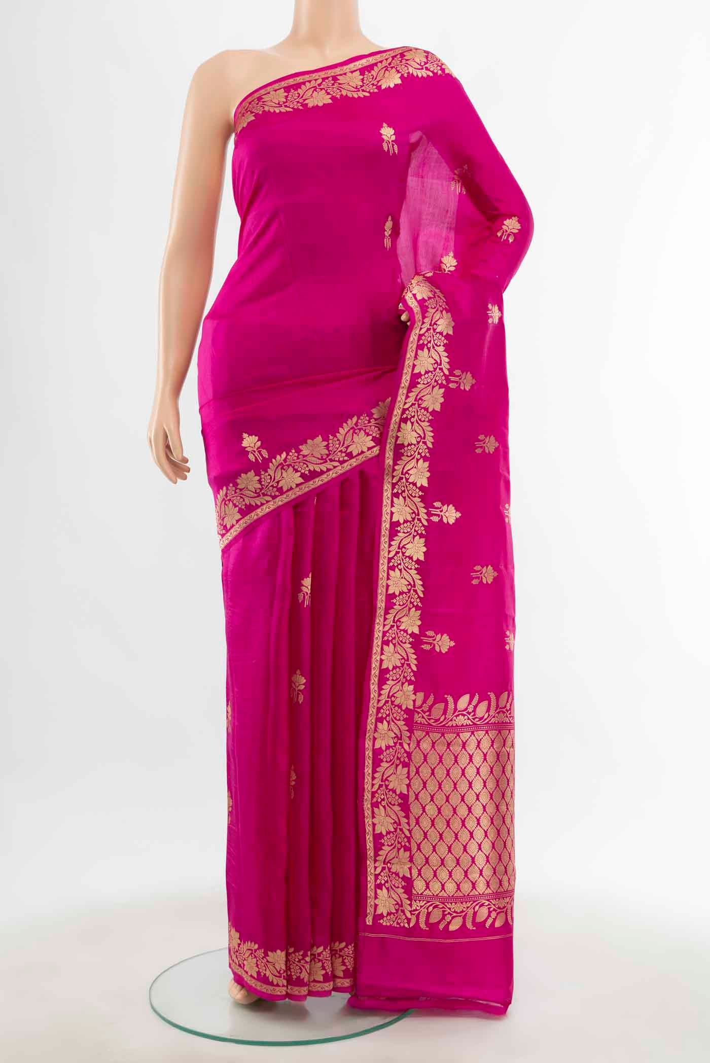 Magenta Banarasi Katan Silk Saree with Zari Butta on the body and Silk Border displayed on a mannequin