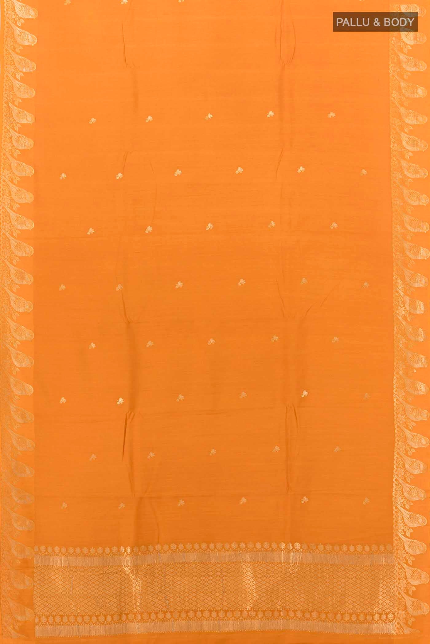 Flat view of Mustard Tussar Silk Saree with Zari Butta on the body and Fancy Border
