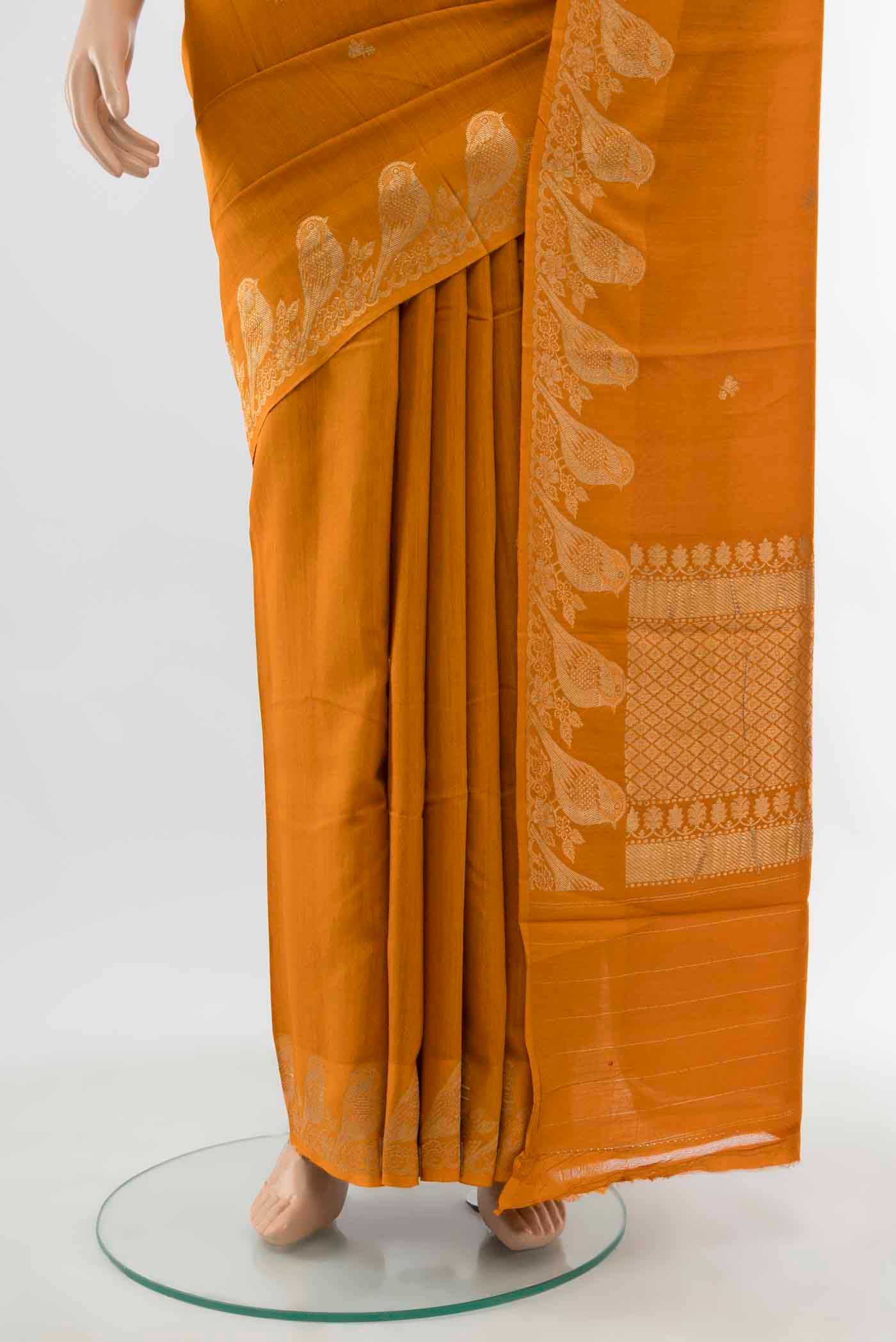 Pleats and pallu of Mustard Tussar Silk Saree with Zari Butta on the body and Fancy Border