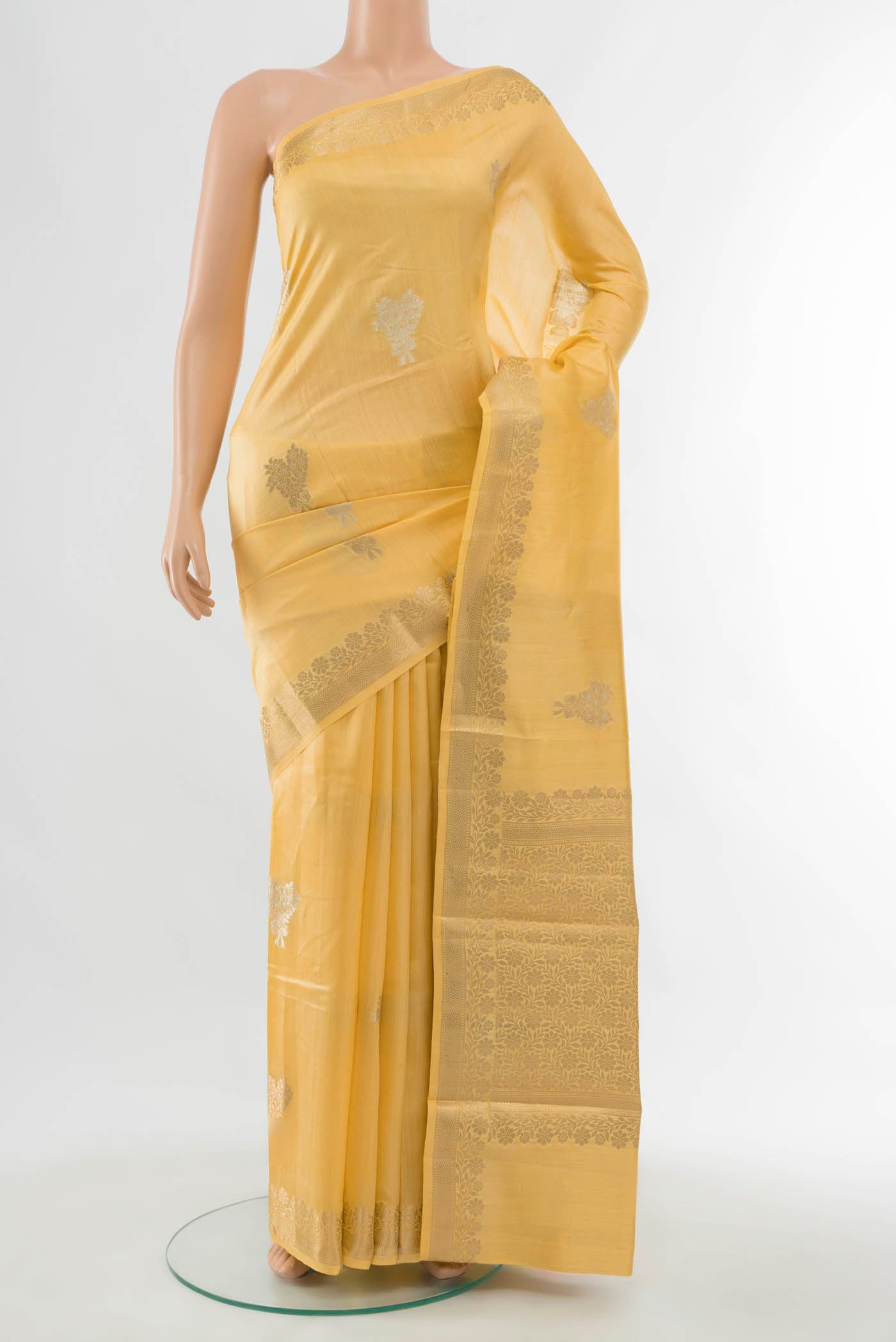 Yellow Banarasi Raw Silk Saree with Zari Butta on the body and Silk Border displayed on a mannequin