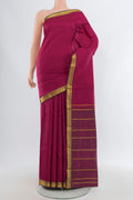 Dark Pink Kanjivaram Silk Saree with Plain Body and Zari Border.  displayed on a mannequin