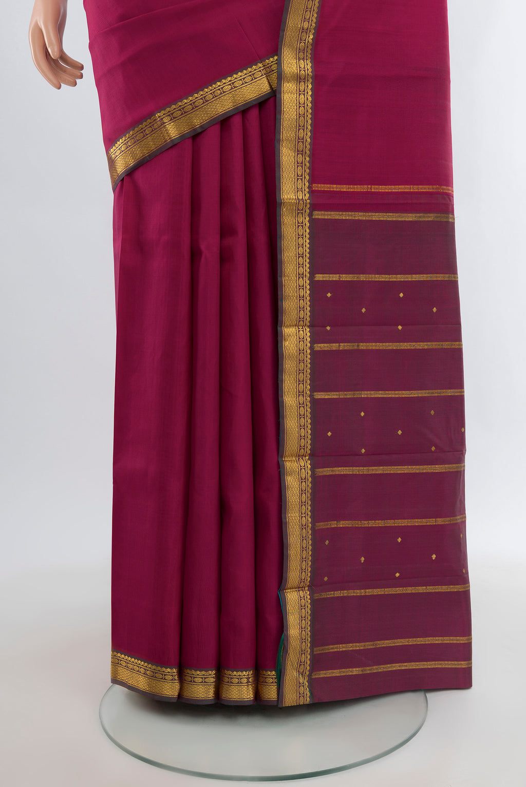 Pleats and pallu of Dark Pink Kanjivaram Silk Saree with Plain Body and Zari Border. 