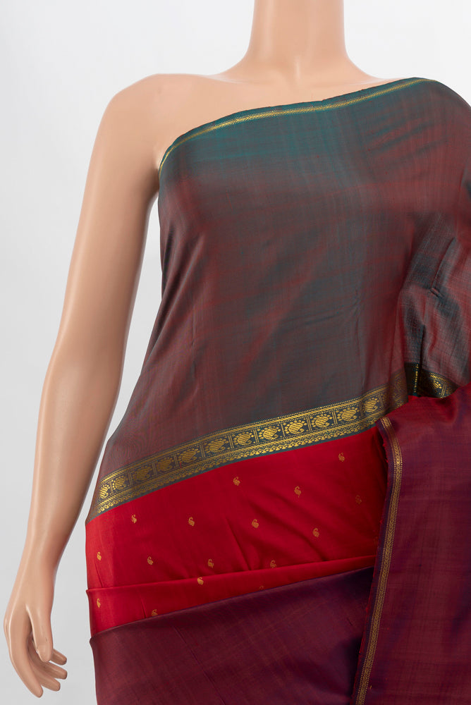 Border image of Maroon Kanjivaram Silk Saree with Zari Butta on the body and Silk Border. 