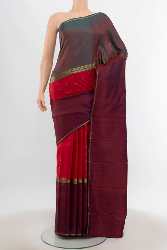 Maroon Kanjivaram Silk Saree with Zari Butta on the body and Silk Border.  displayed on a mannequin