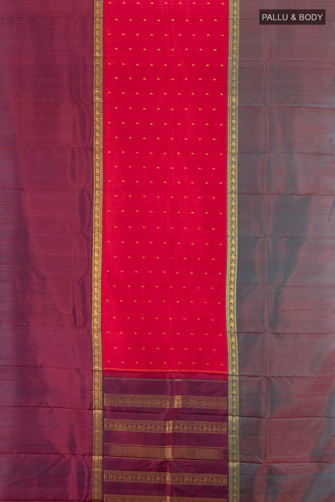 Flat view of Maroon Kanjivaram Silk Saree with Zari Butta on the body and Silk Border. 