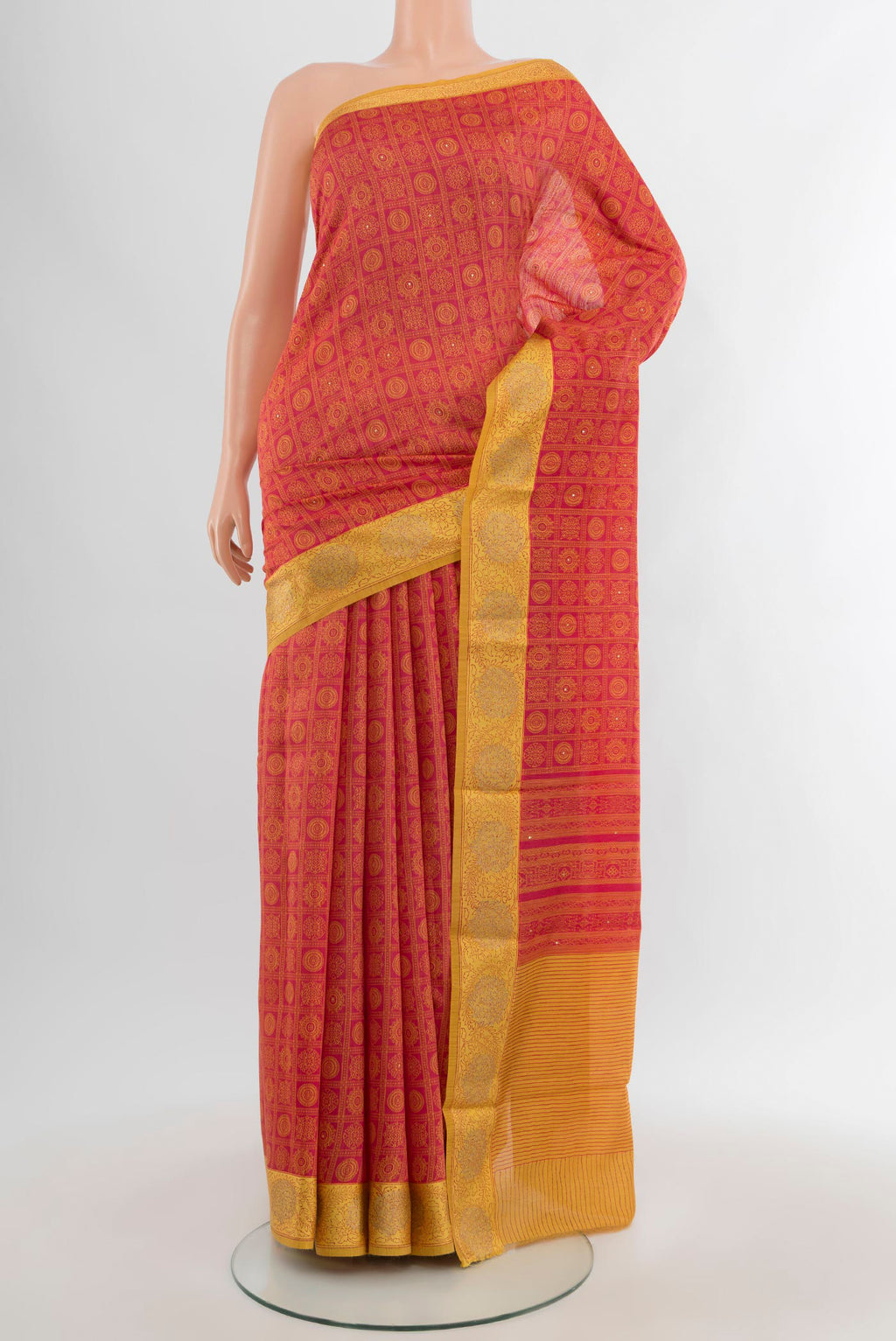 Red Tussar Silk Saree with Floral Print on the body and Embroidery Border.  displayed on a mannequin