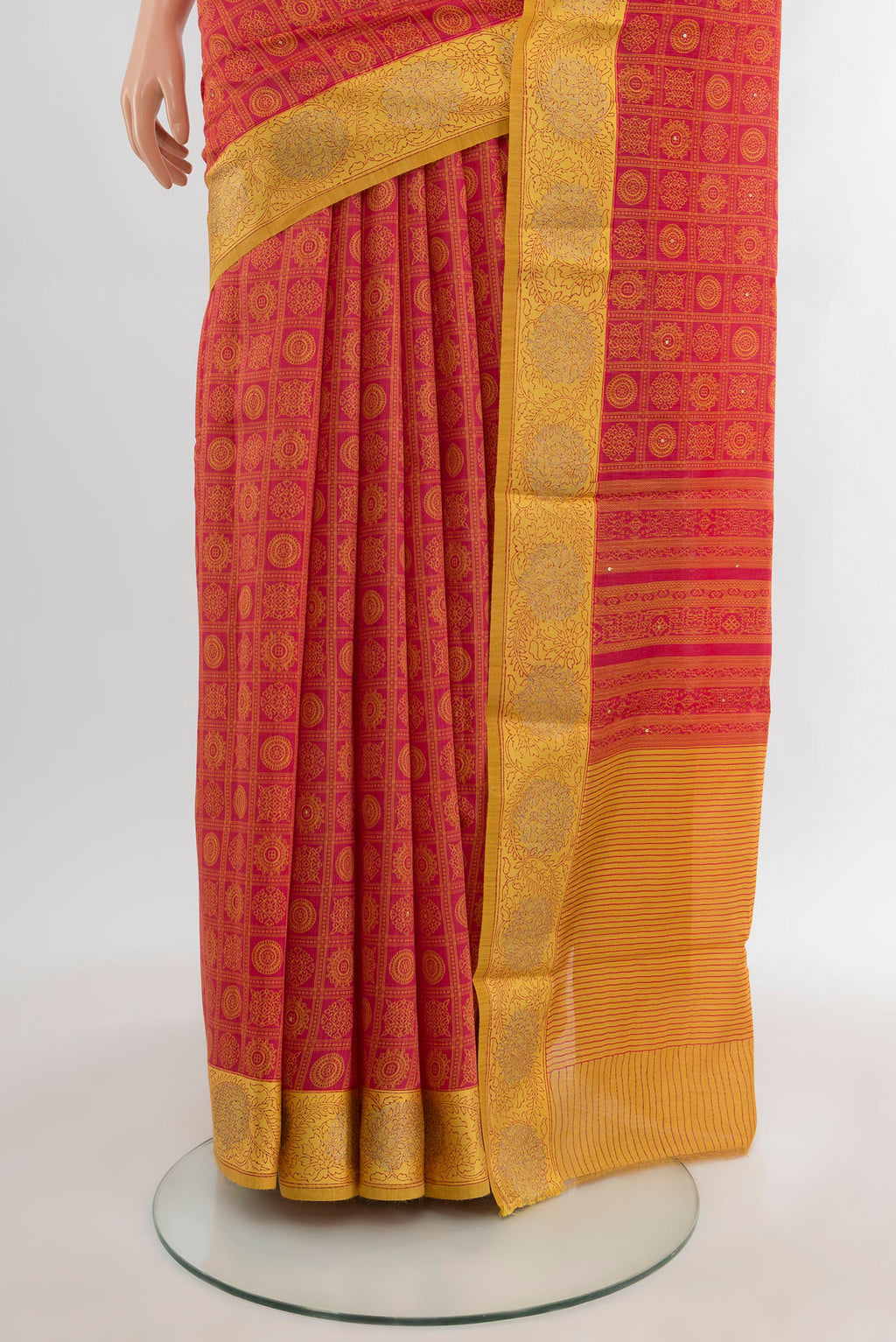 Pleats and pallu of Red Tussar Silk Saree with Floral Print on the body and Embroidery Border. 