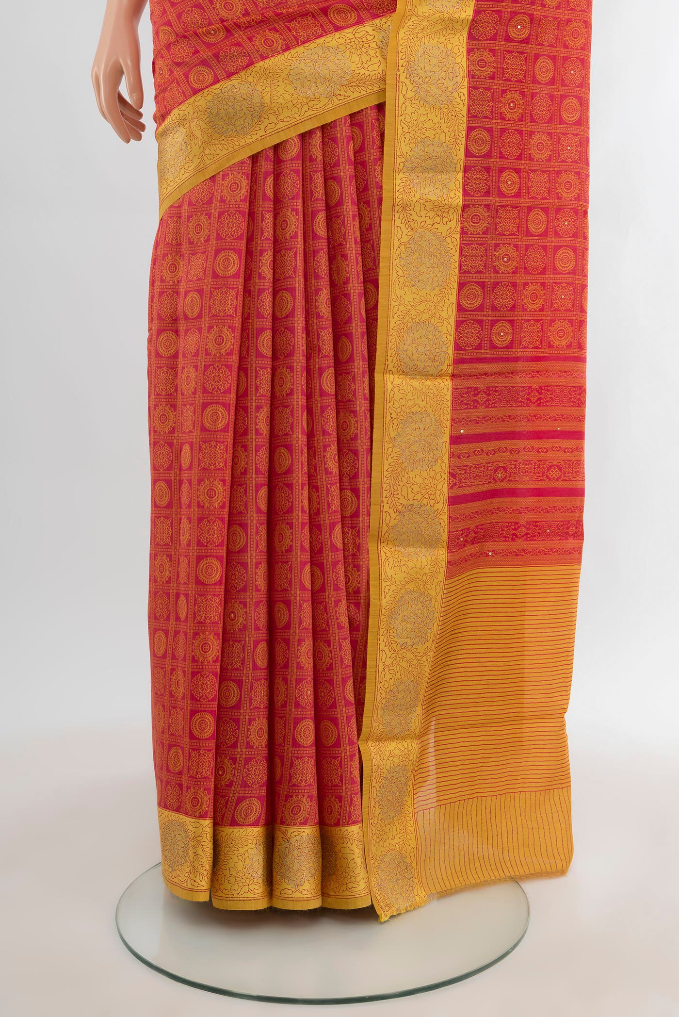 Pleats and pallu of Red Tussar Silk Saree with Floral Print on the body and Embroidery Border. 