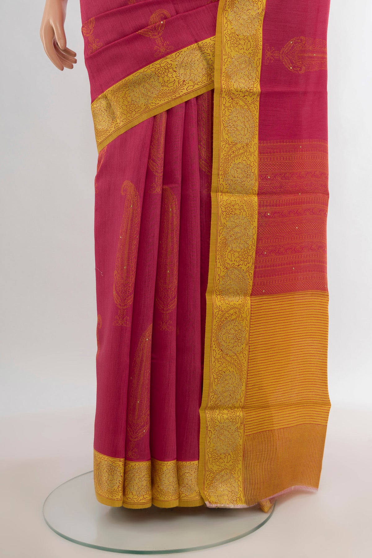 Pleats and pallu of Pink Tussar Silk Saree with Floral Print on the body and Zari Border. 