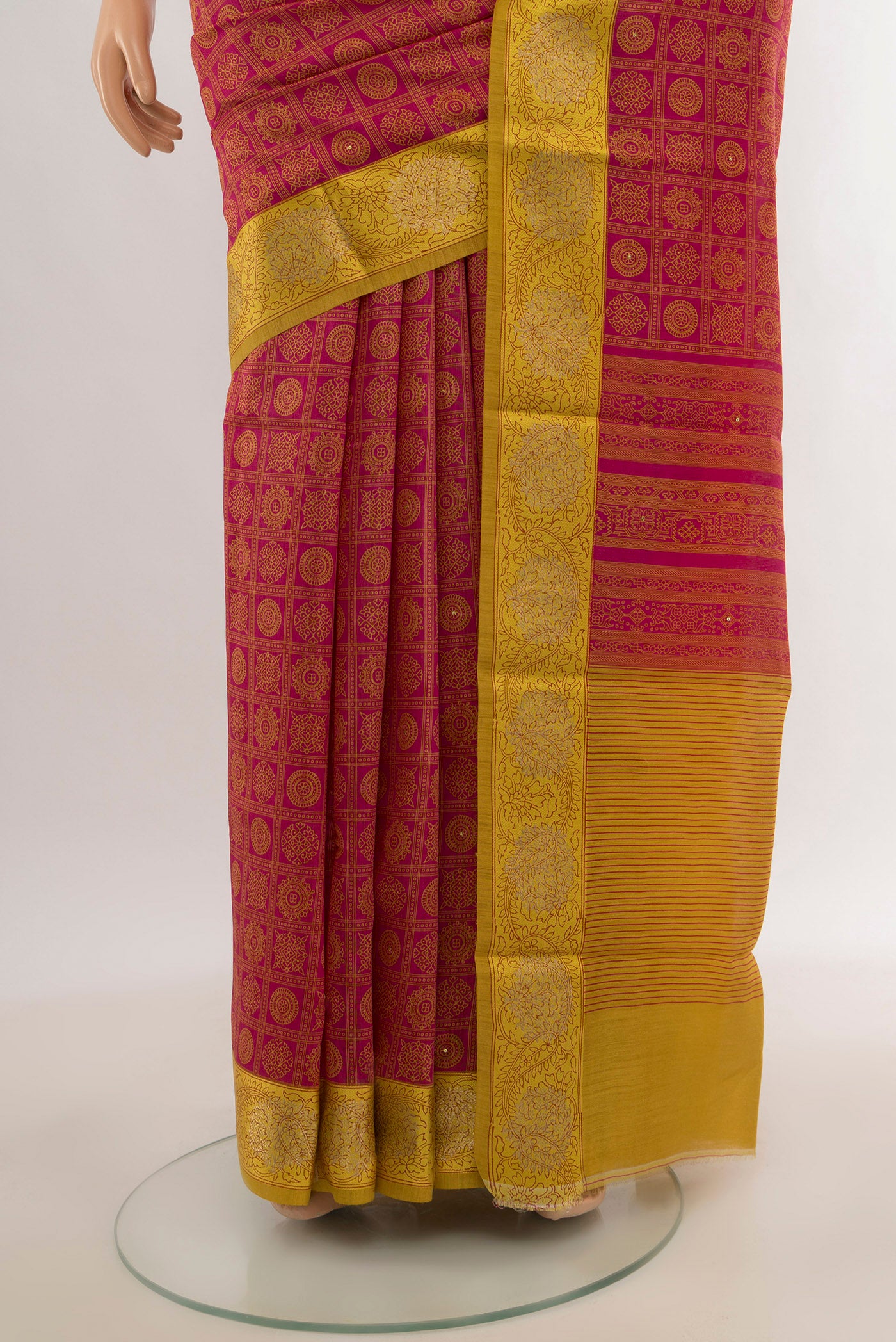 Pleats and pallu of Pink Tussar Silk Saree with Floral Print on the body and Zari Border. 