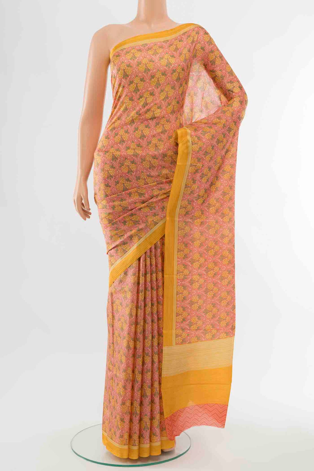Pink Printed Silk Saree with Floral Print on the body and Fancy Border displayed on a mannequin