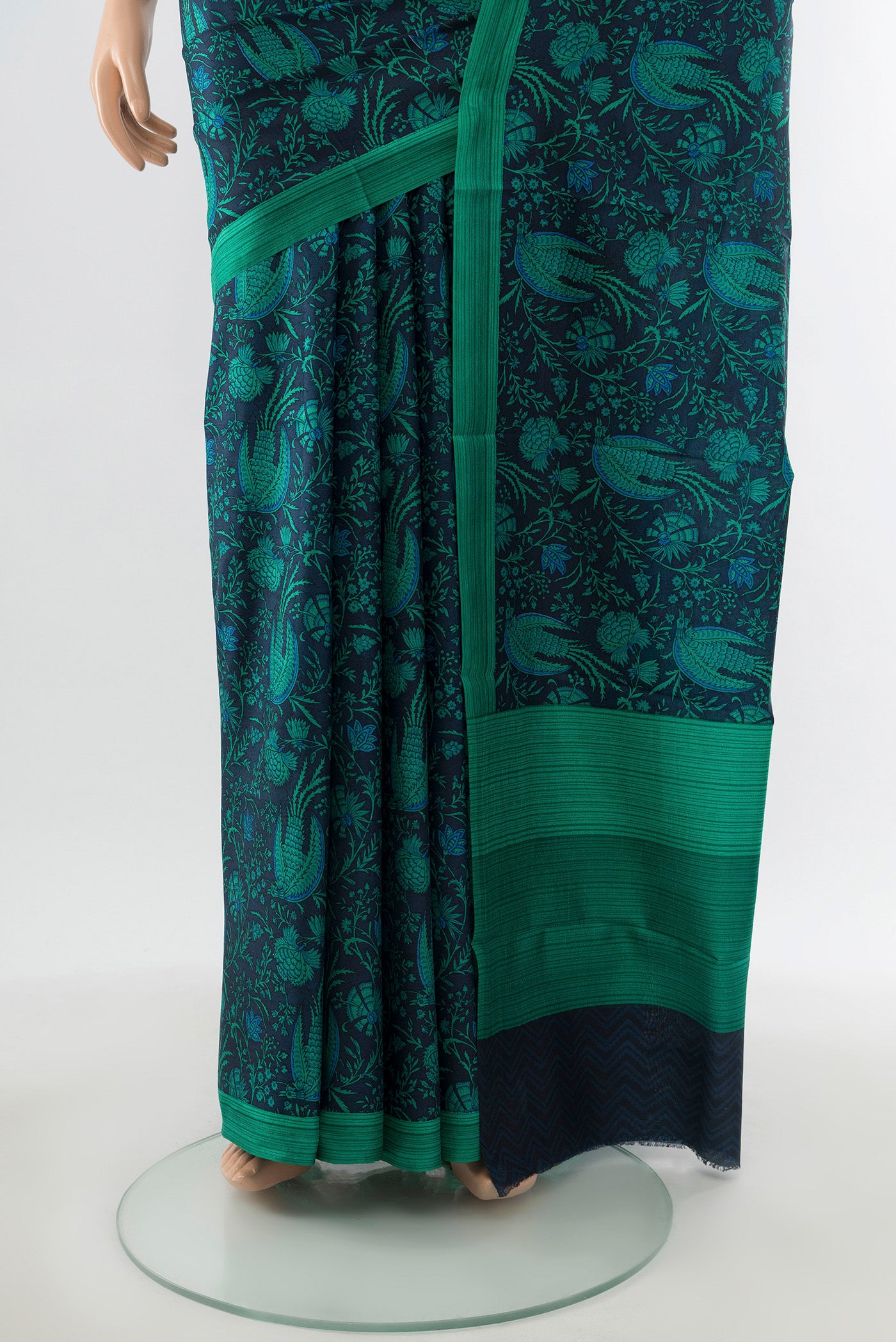 Pleats and pallu of Navy Blue Printed Silk Saree with Floral Print on the body and Printed Border. 