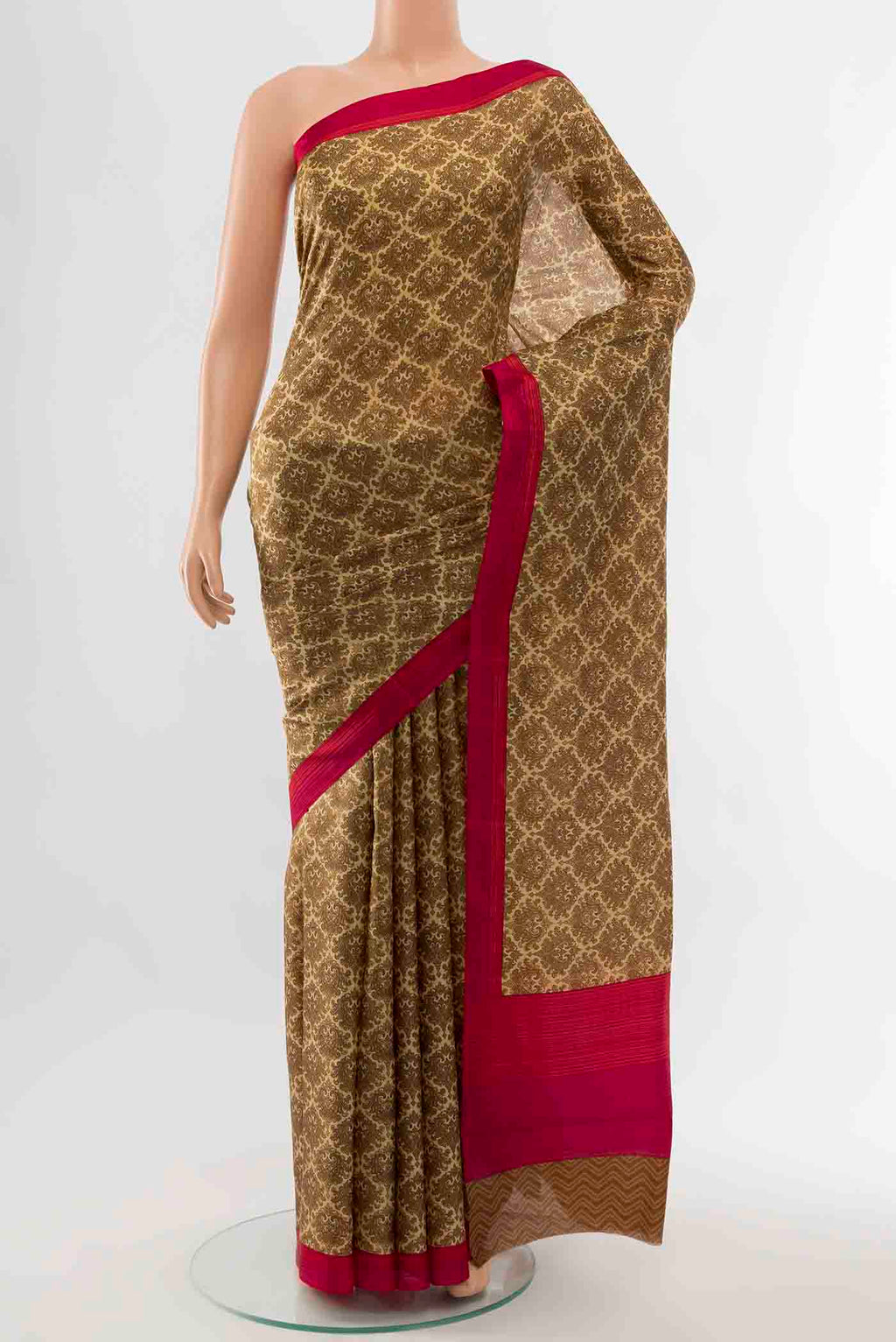Bronze Printed Silk Saree with Floral Print on the body and Fancy Border displayed on a mannequin