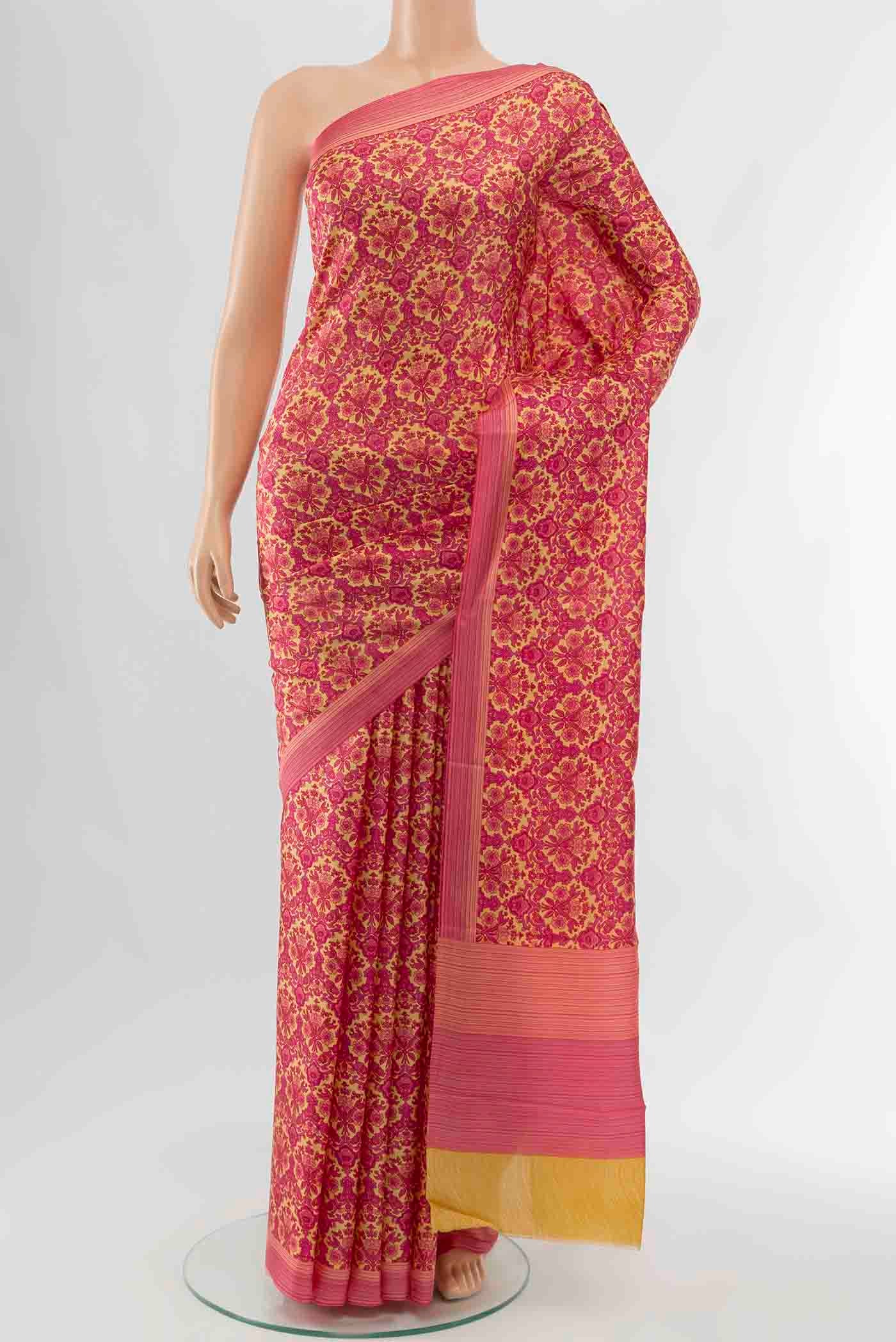 Dark Pink Printed Silk Saree with Floral Print on the body and Fancy Border displayed on a mannequin