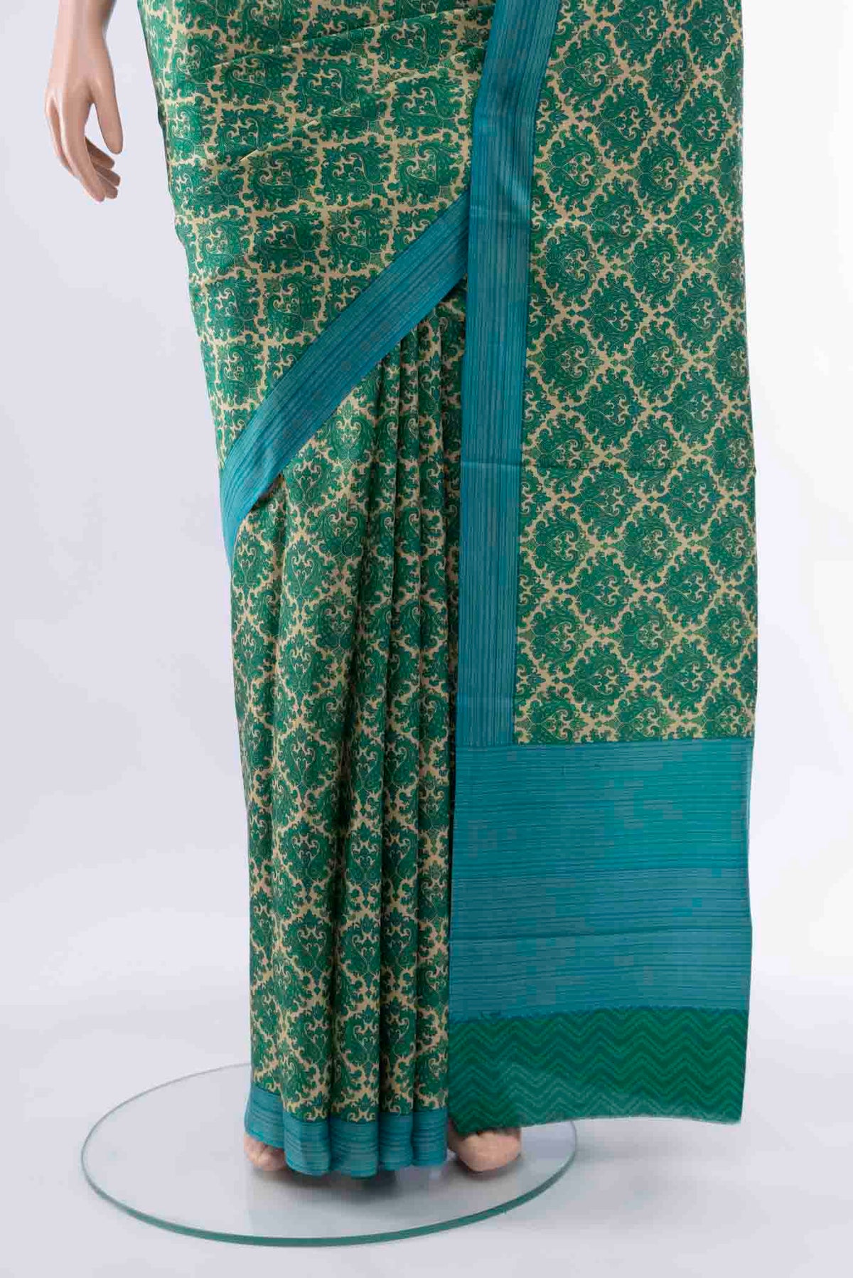 Pleats and pallu of Green Printed Silk Saree with Floral Print on the body and Fancy Border
