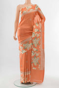 Orange Tussar Silk Saree with Floral Print on the body and Silk Border displayed on a mannequin