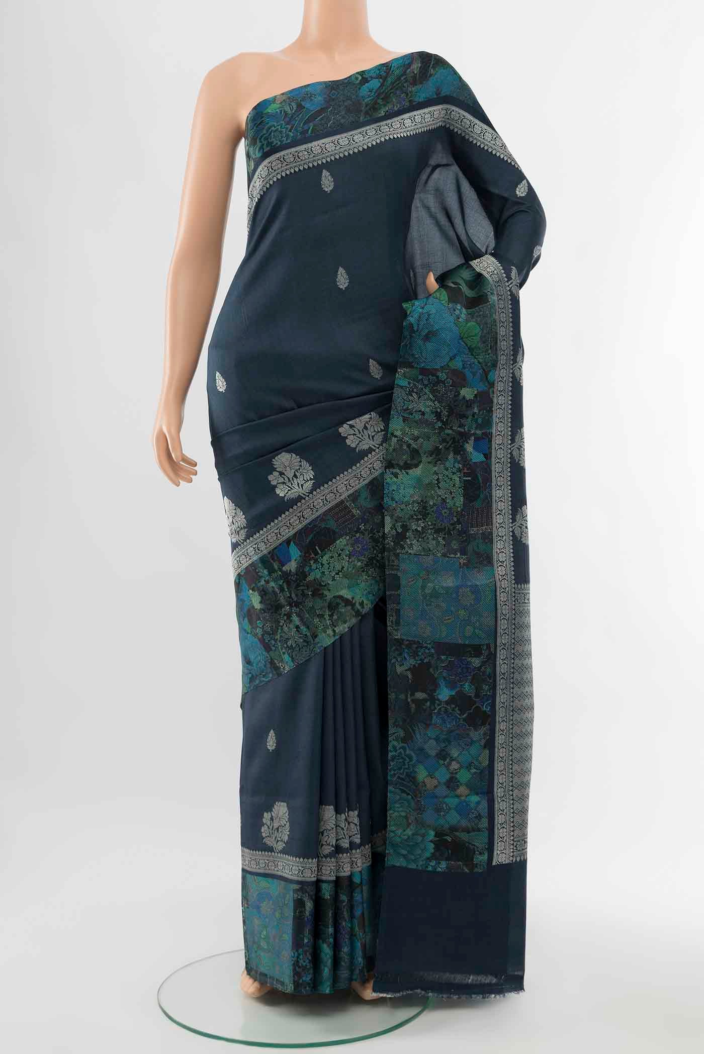 Navy Blue Tussar Silk Saree with Floral Print on the body and Silk Border displayed on a mannequin