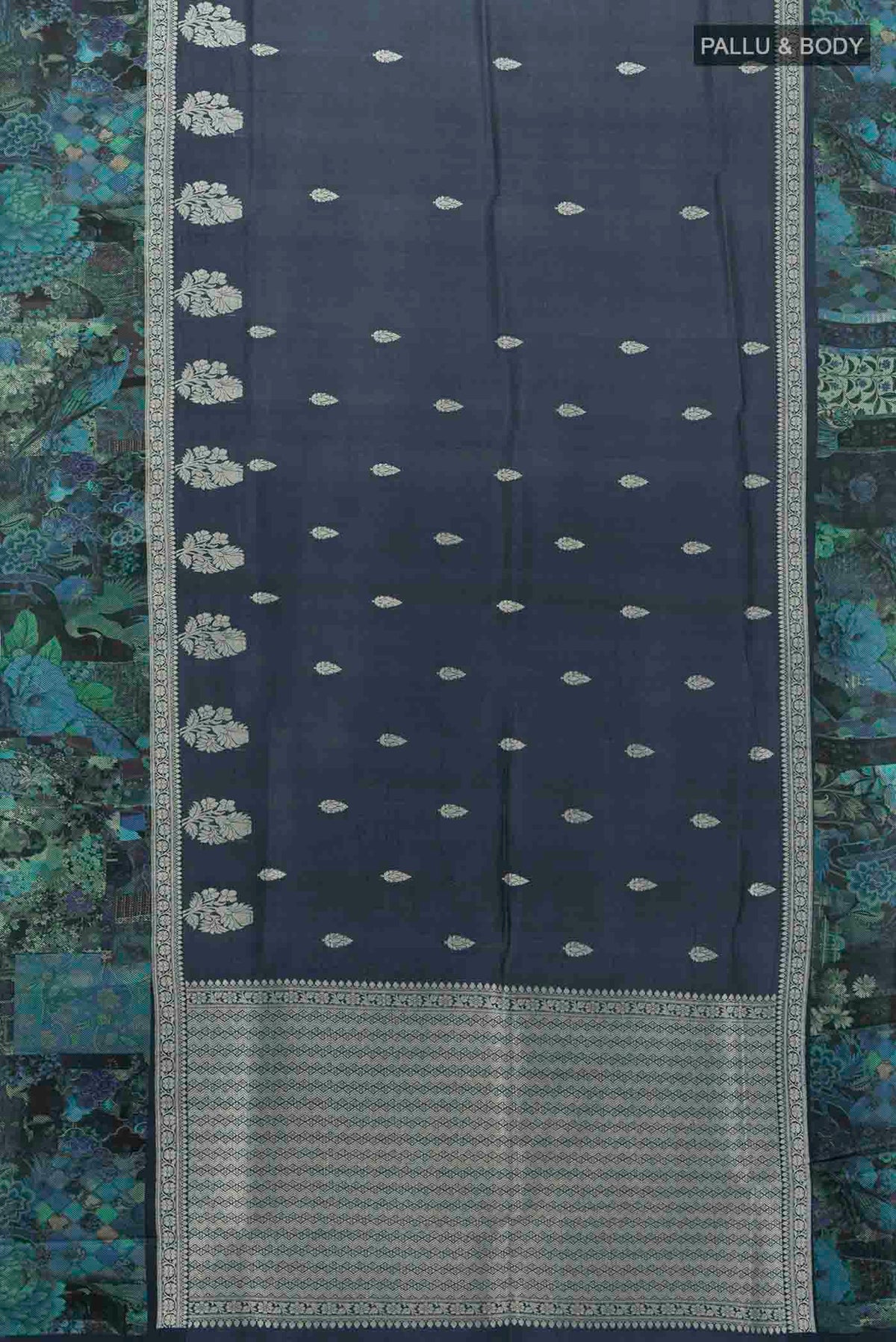 Flat view of Navy Blue Tussar Silk Saree with Floral Print on the body and Silk Border