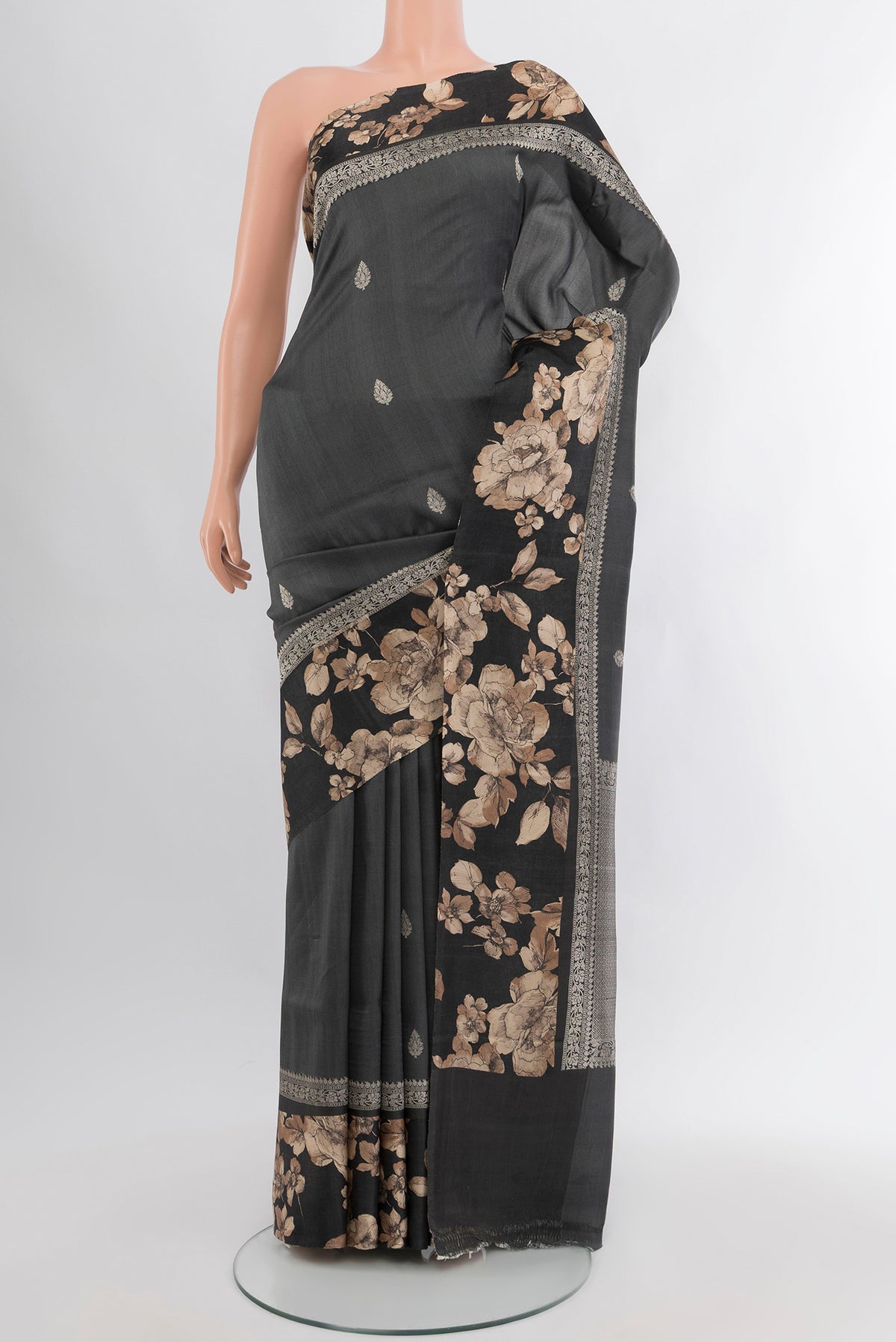 Grey Tussar Silk Saree with Zari Butta on the body and Fancy Border.  displayed on a mannequin