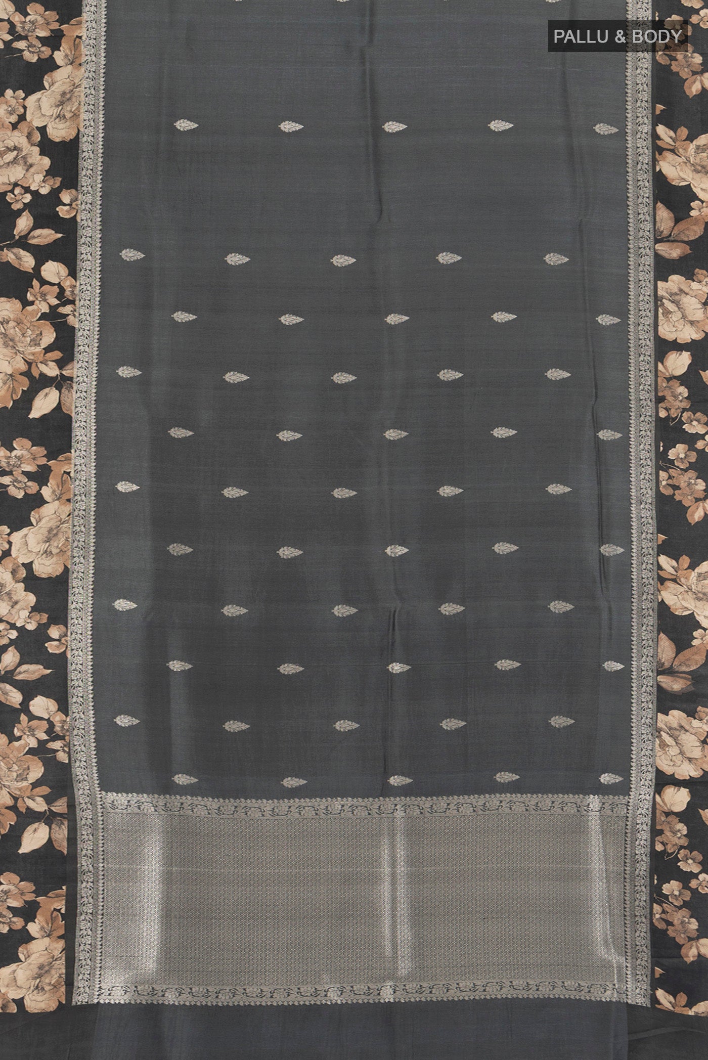 Flat view of Grey Tussar Silk Saree with Zari Butta on the body and Fancy Border. 