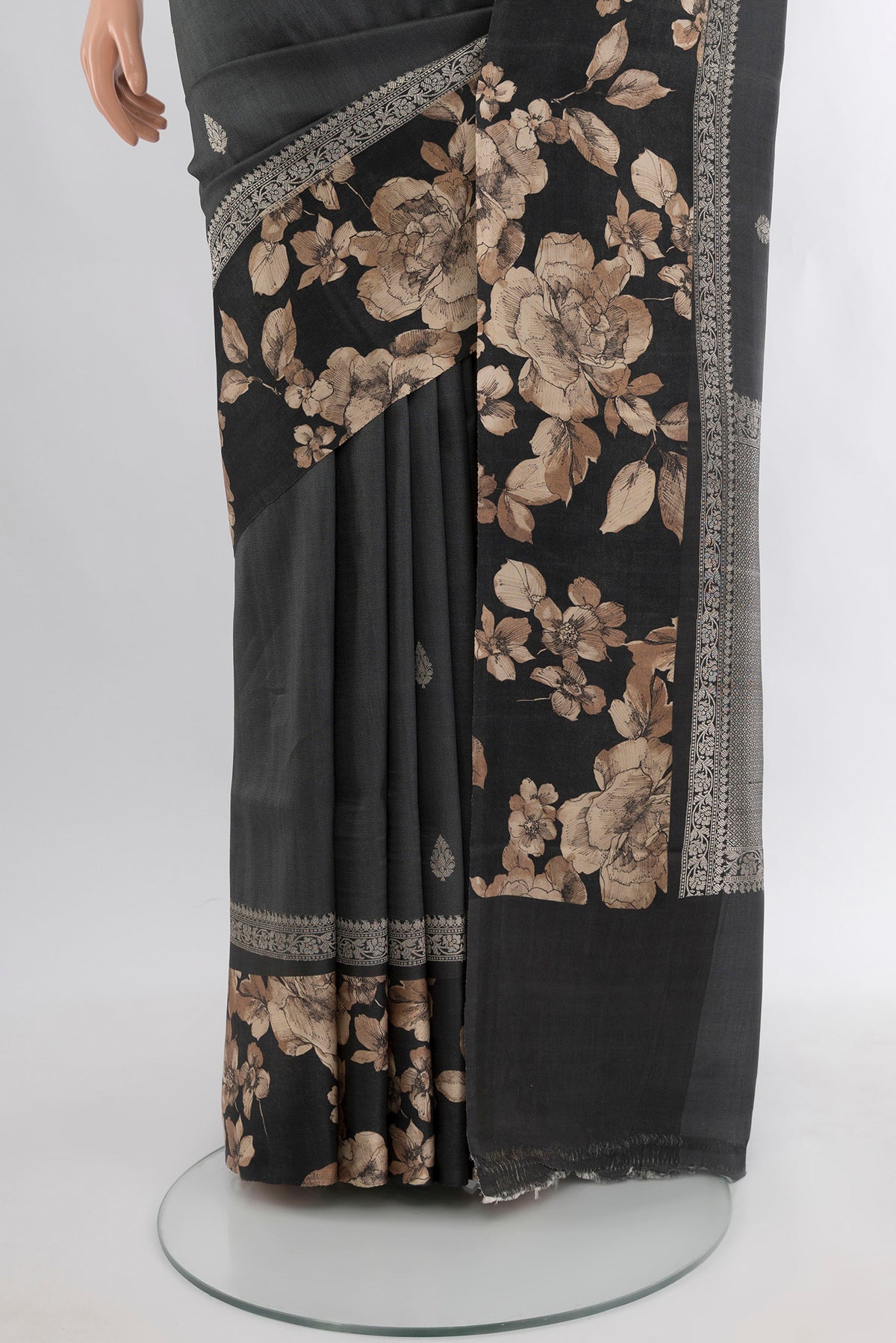 Pleats and pallu of Grey Tussar Silk Saree with Zari Butta on the body and Fancy Border. 