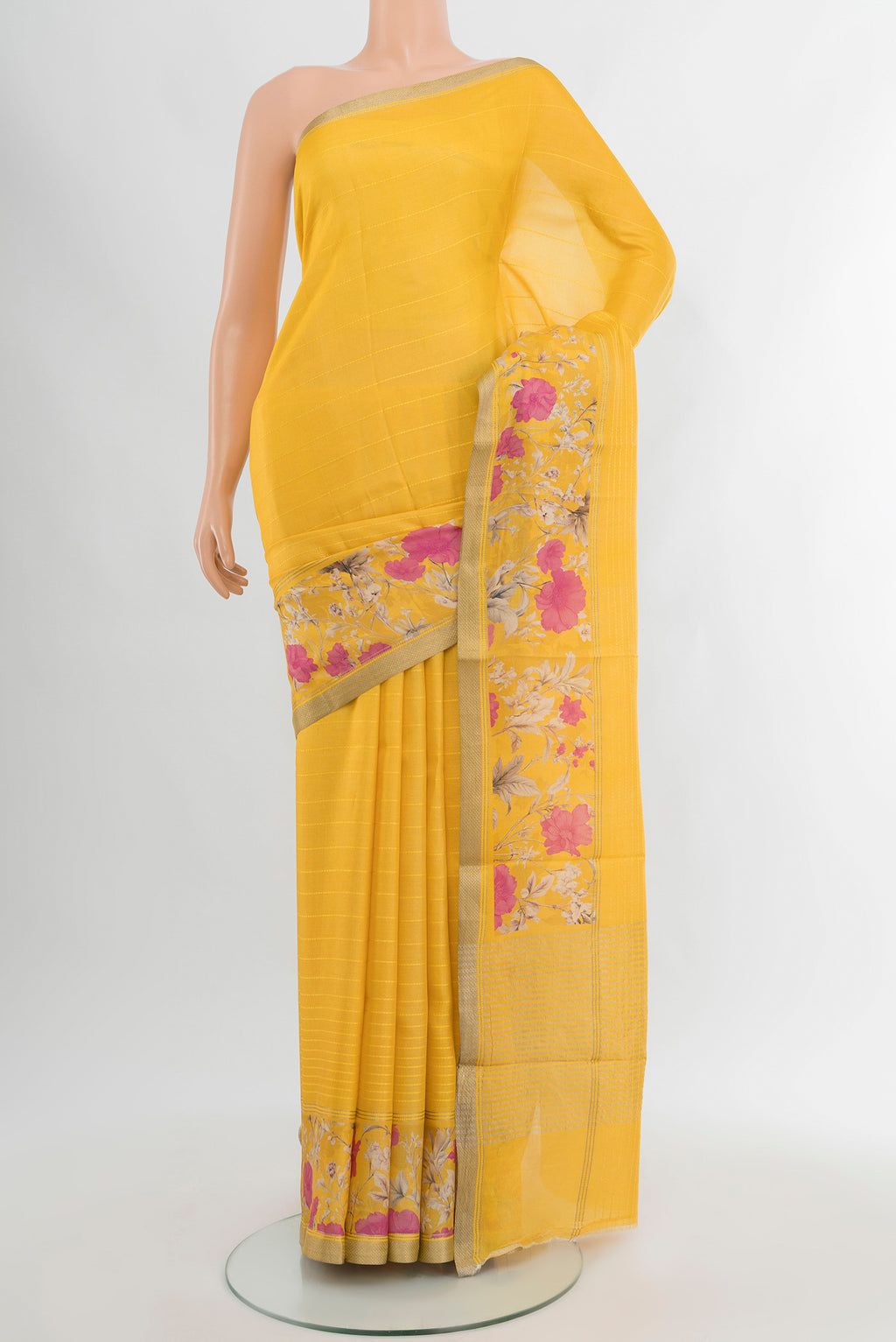 Yellow Tussar Silk Saree with Stripes on the body and Zari Border.  displayed on a mannequin