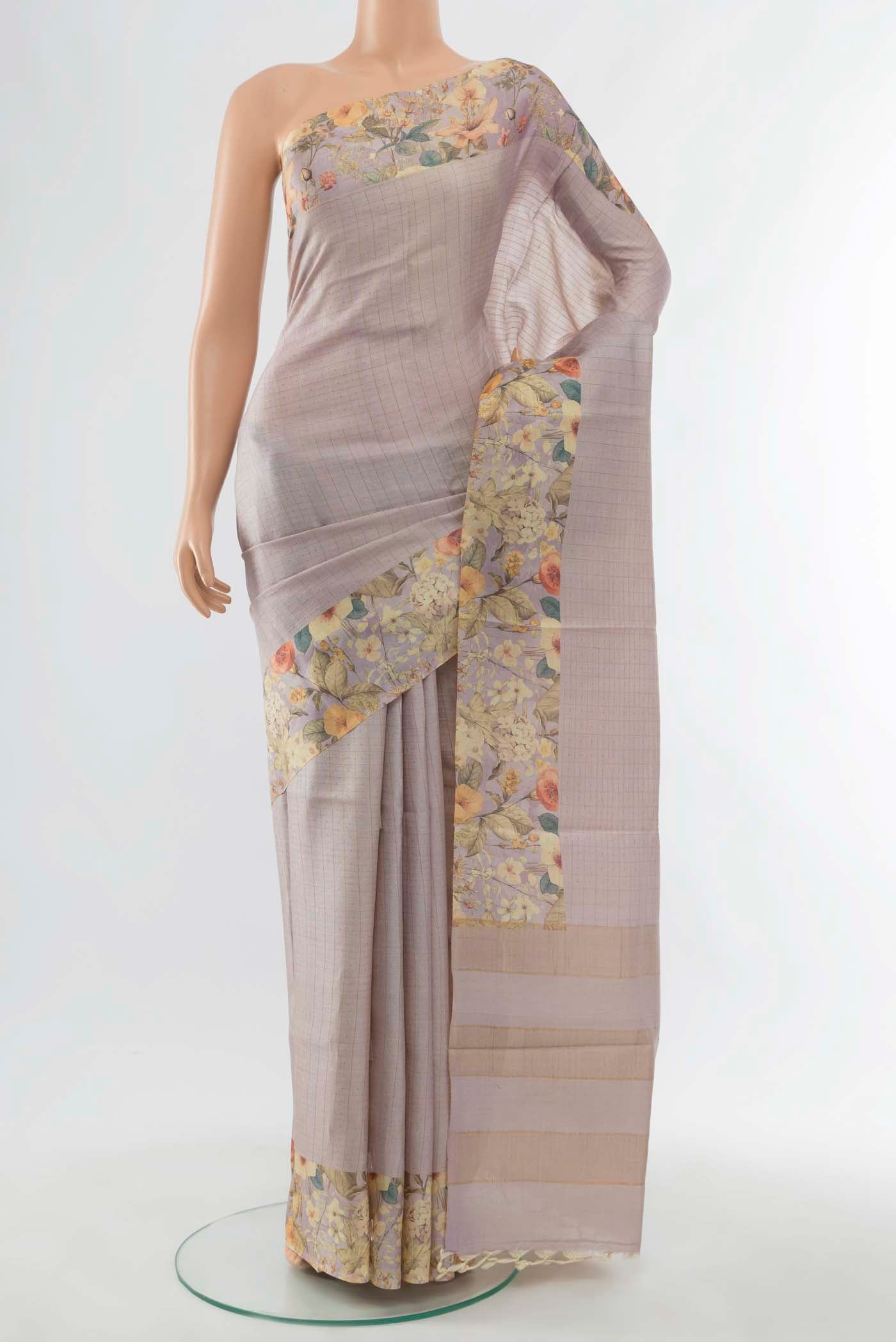 Lavender Tussar Silk Saree with Floral Print on the body and Thread Border displayed on a mannequin