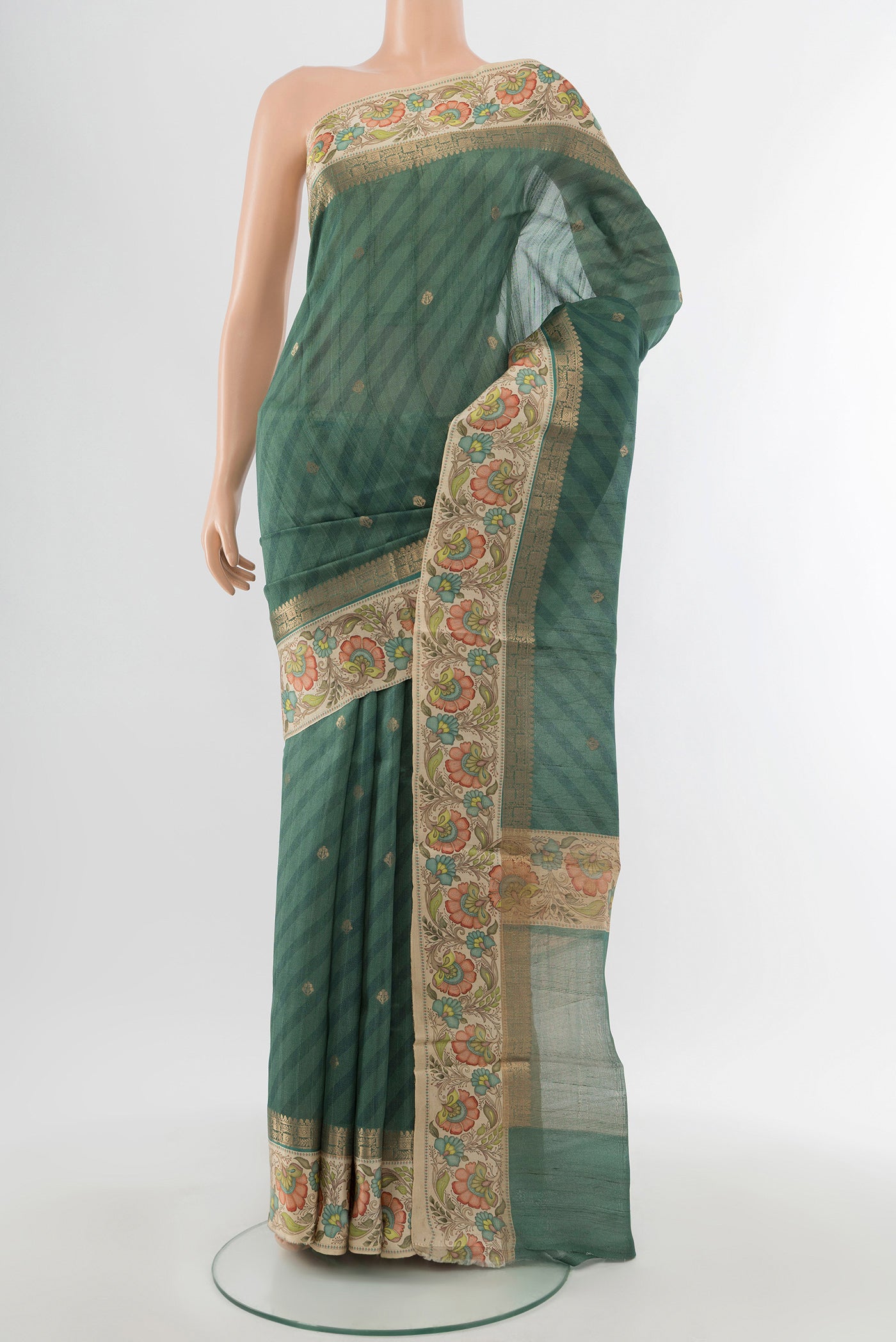 Davys Grey Tussar Silk Saree with Zari Butta on the body and Fancy Border.  displayed on a mannequin