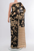 Black Tussar Silk Saree with Floral Print on the body and Plain Border.  displayed on a mannequin
