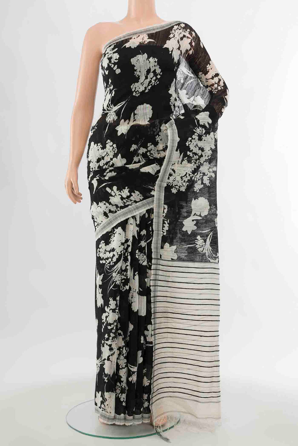 Black Bhagalpuri Tussar Silk Saree with Floral Print on the body and Plain Border displayed on a mannequin