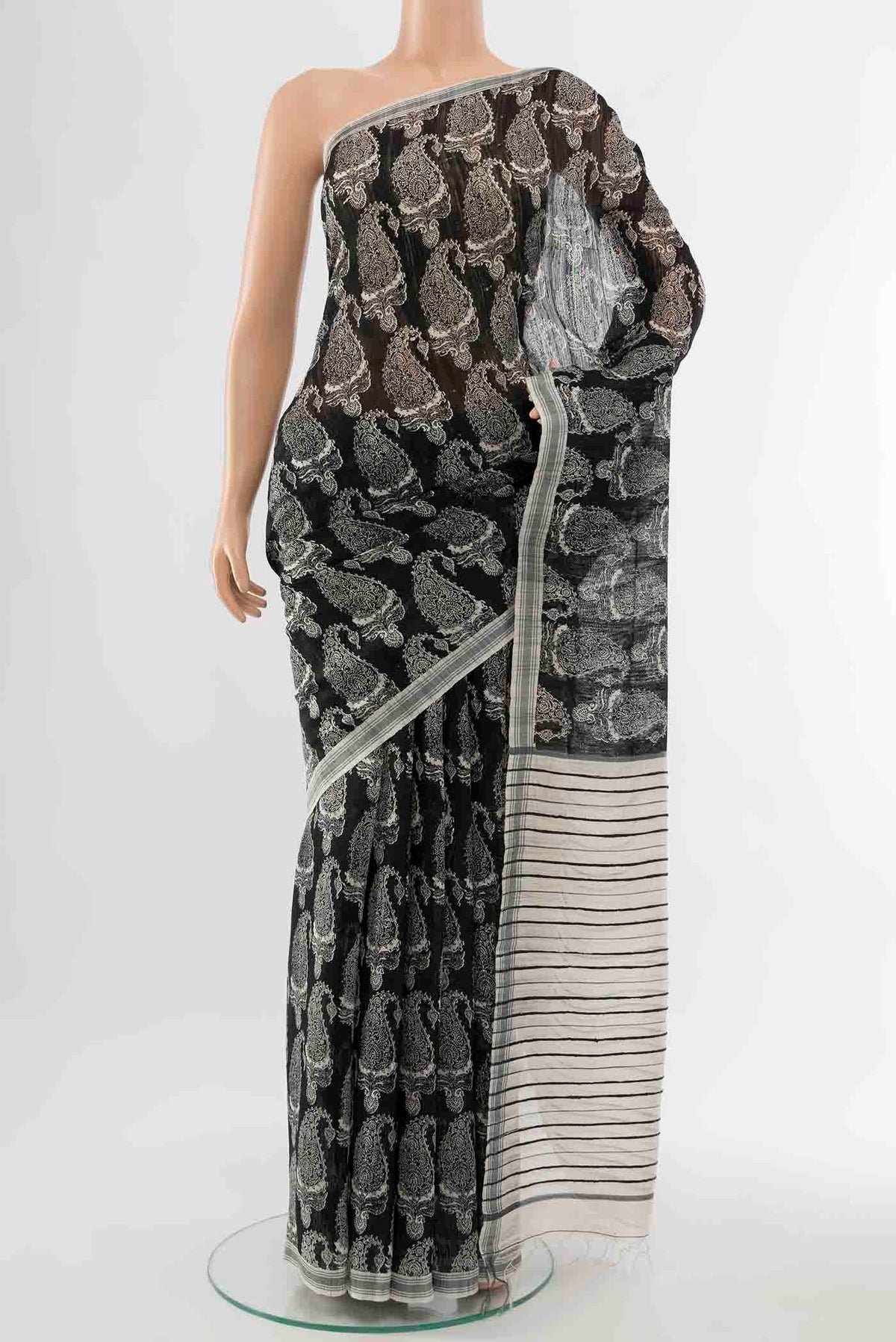 Black Tussar Silk Saree with Zari Butta on the body and Zari Border displayed on a mannequin