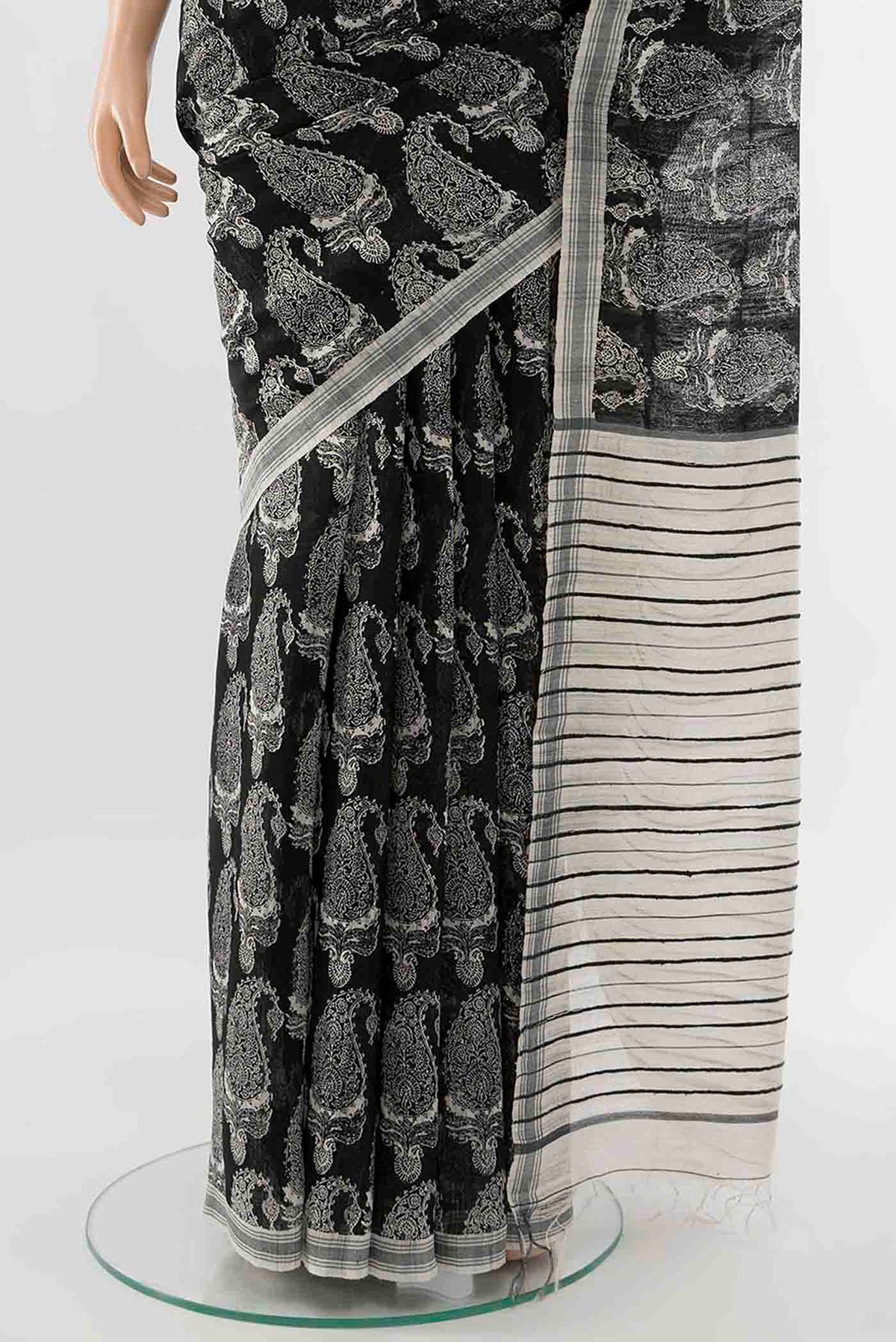 Pleats and pallu of Black Tussar Silk Saree with Zari Butta on the body and Zari Border