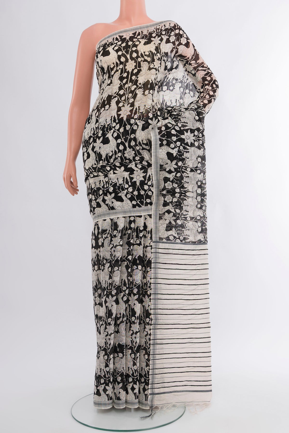 Black Tussar Silk Saree with Floral Print on the body and Plain Border.  displayed on a mannequin
