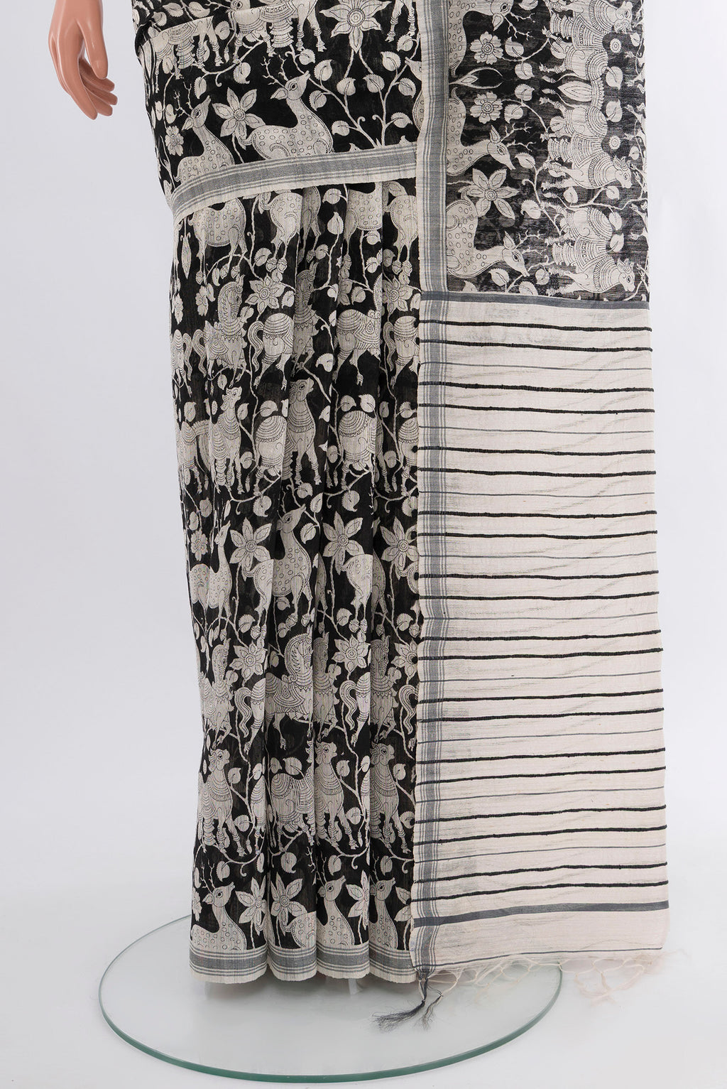 Pleats and pallu of Black Tussar Silk Saree with Floral Print on the body and Plain Border. 