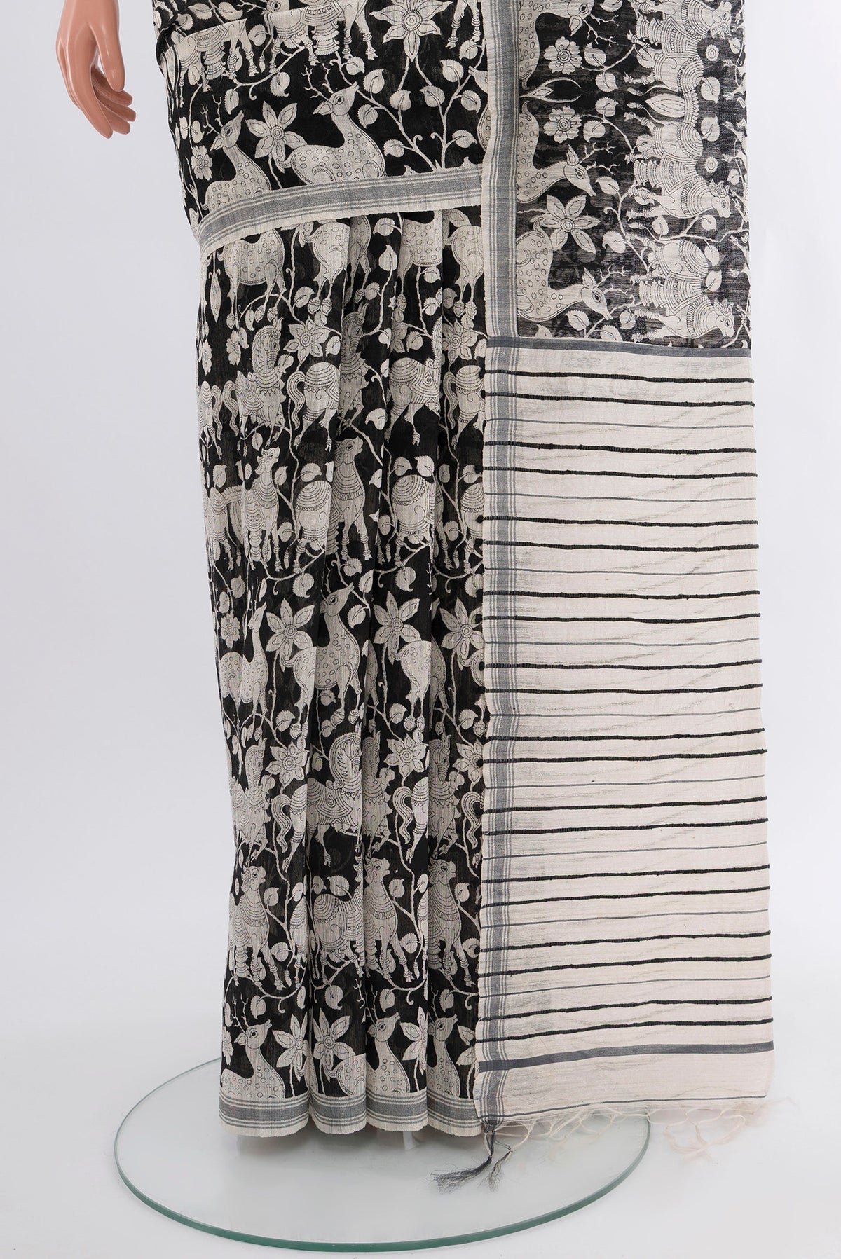 Pleats and pallu of Black Tussar Silk Saree with Floral Print on the body and Plain Border. 
