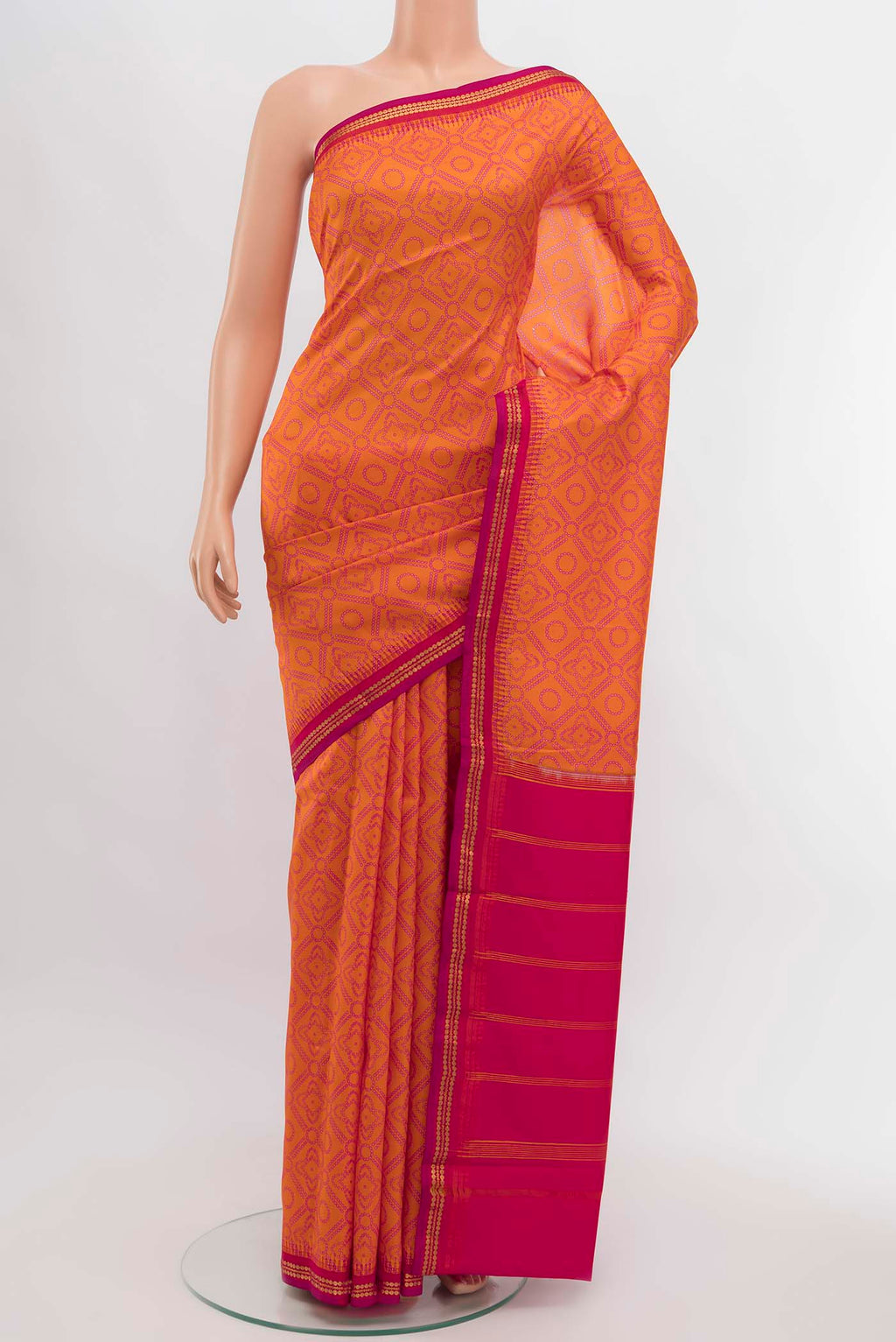 Orange Printed Silk Saree with Zari Butta on the body and Silk Border displayed on a mannequin