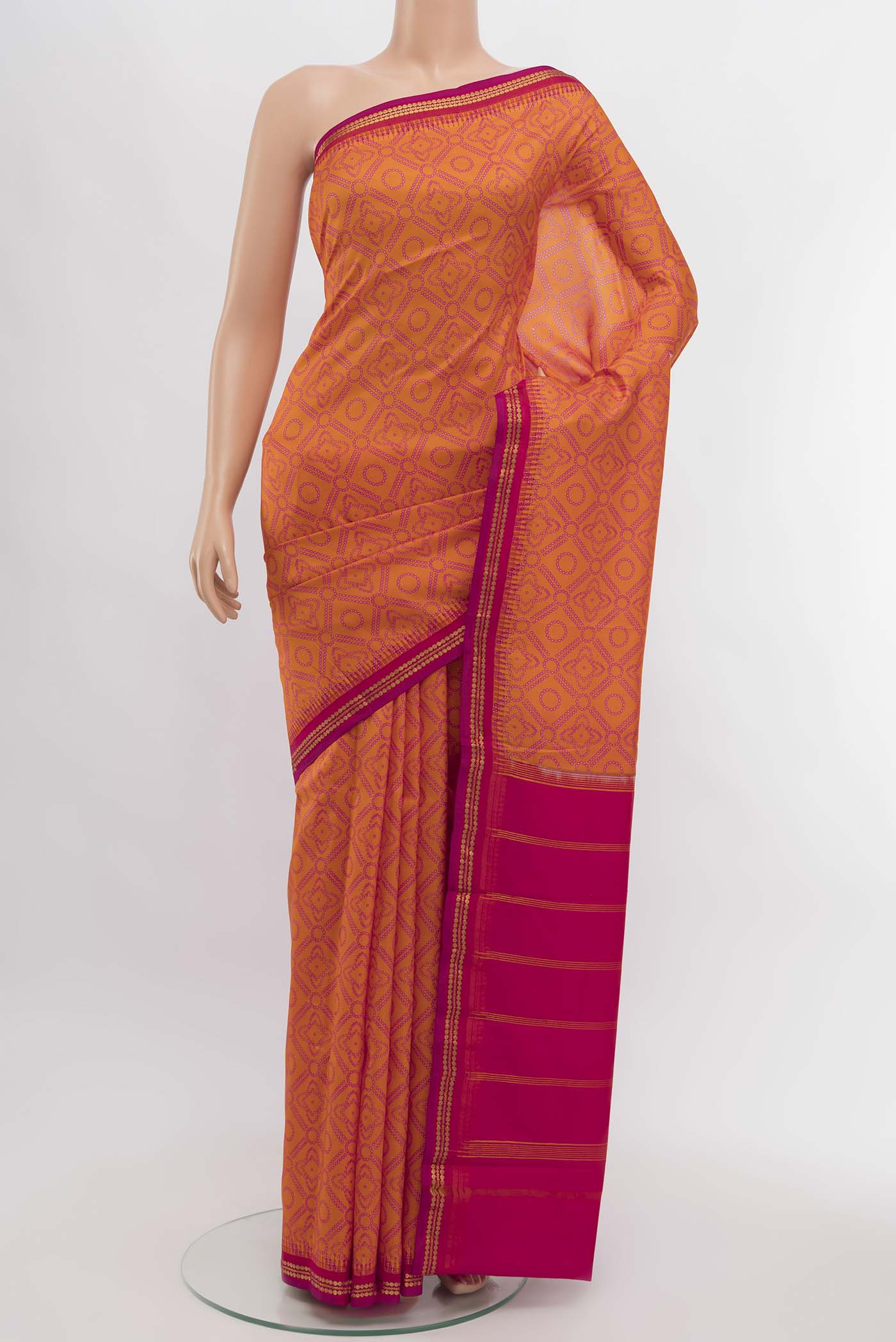 Orange Printed Silk Saree with Zari Butta on the body and Silk Border displayed on a mannequin