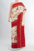 Off White Printed Silk Saree with Floral Print on the body and Zari Border.  displayed on a mannequin