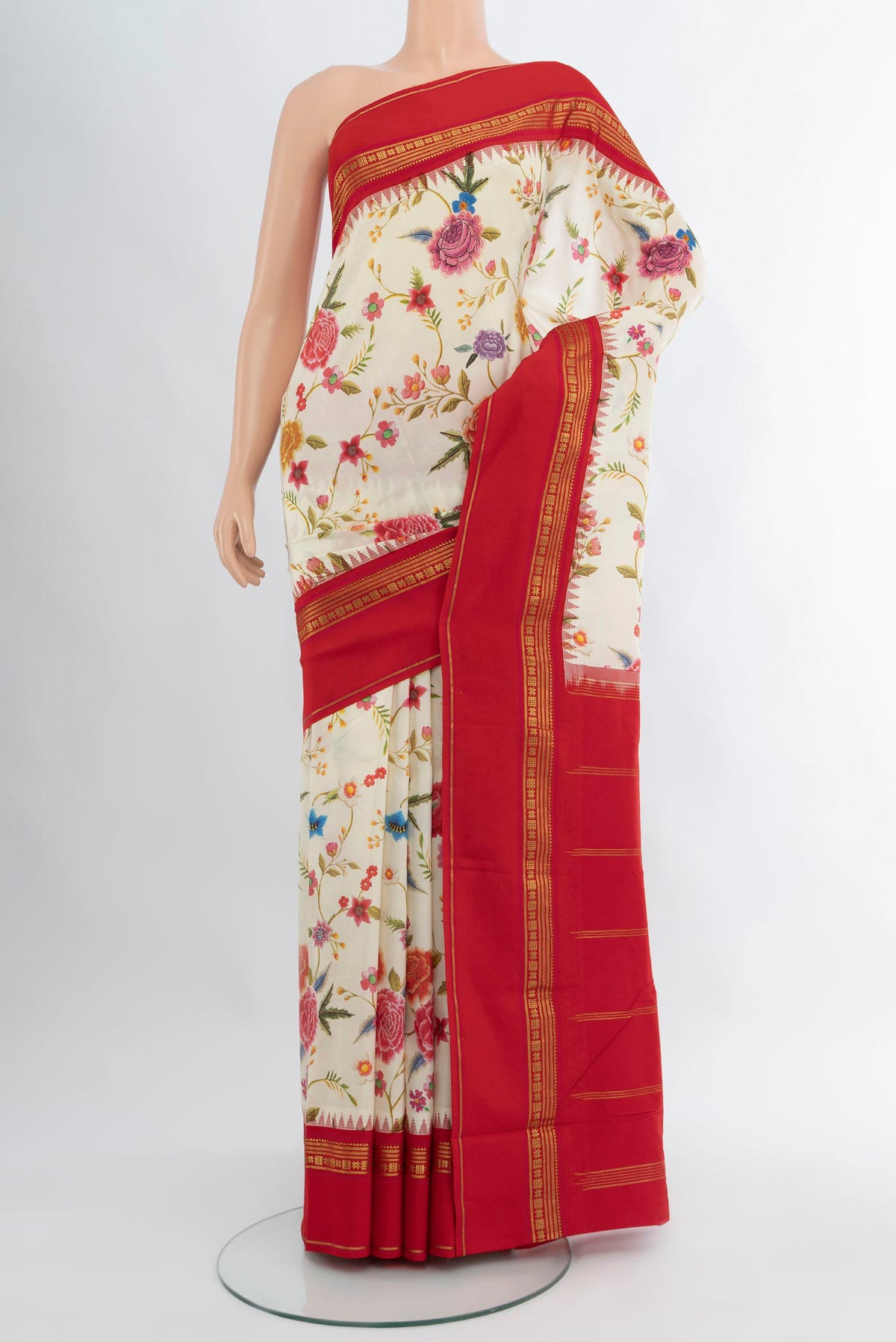 Off White Printed Silk Saree with Floral Print on the body and Zari Border.  displayed on a mannequin