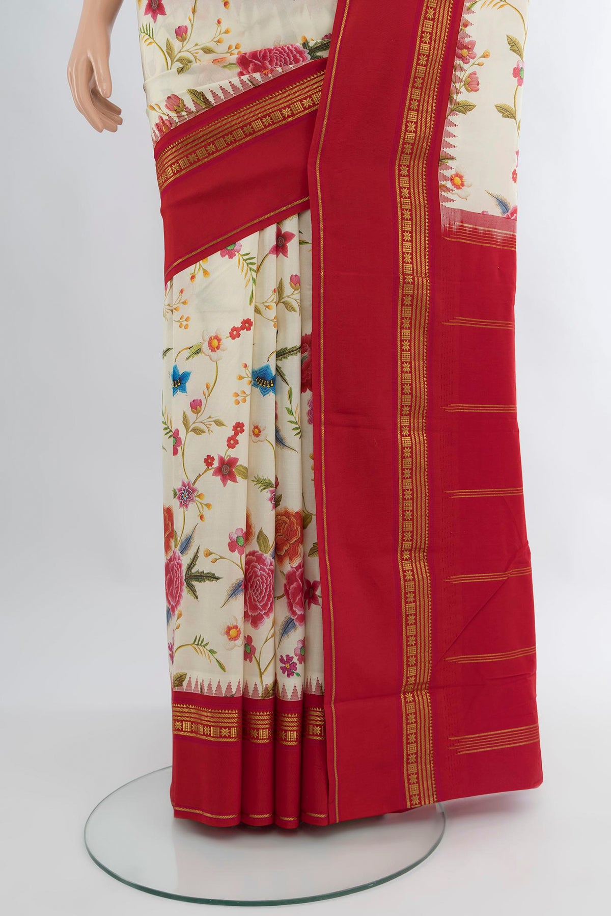 Pleats and pallu of Off White Printed Silk Saree with Floral Print on the body and Zari Border. 